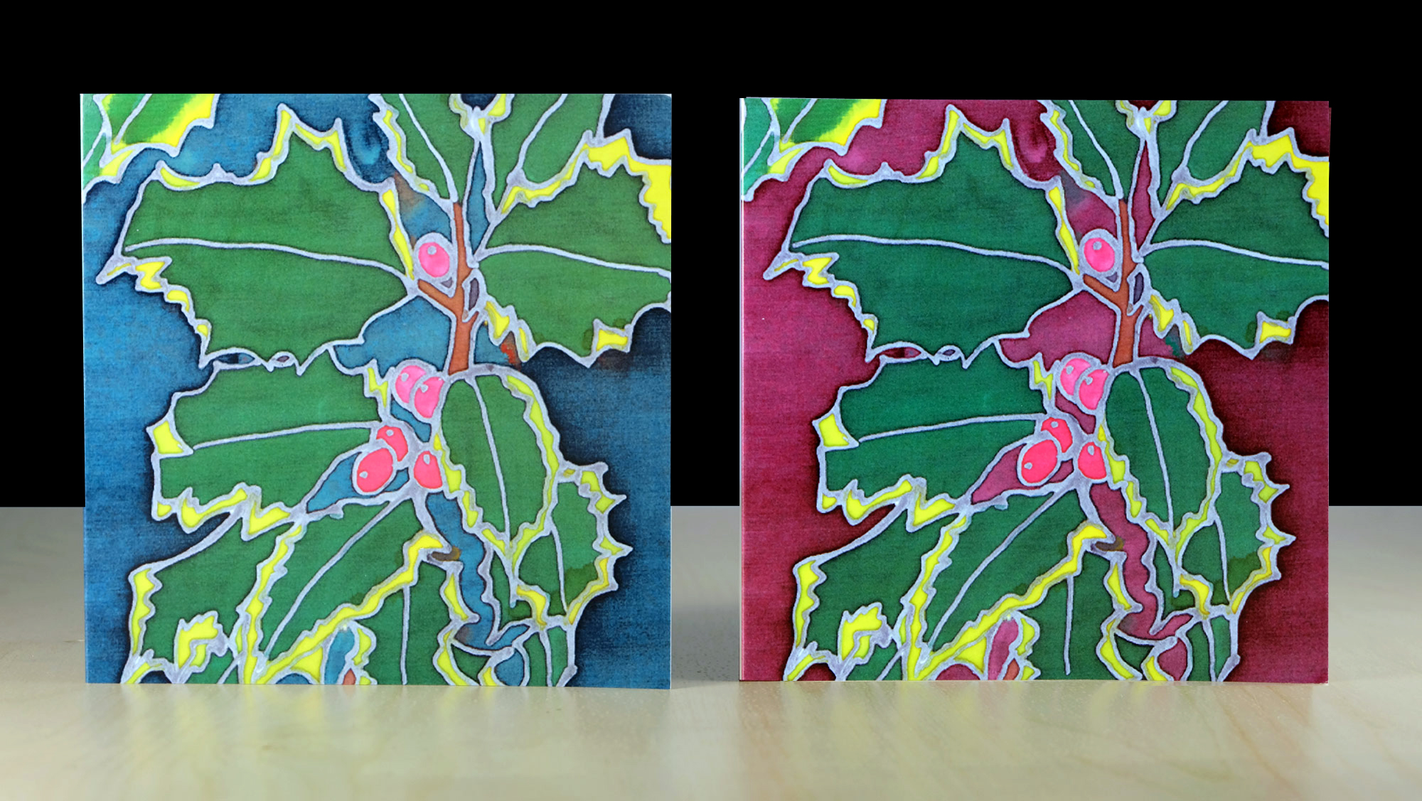 A pack of 6 quality Christmas Holly greeting cards and envelopes. Message: Merry Christmas and a Happy New Year Featuring original silk painted illustrations by Sherren McCabe-Finlayson. Other non-seasonal illustrations available include Autumn Leaves, Cow Parsley, Tulips and 'After Klimt'. These cards are perfect for quick notes, or birthday wishes for anyone who loves nature. You can find them all in our shop. Printed on quality card, gloss laminated and supplied as a set of 3 red and 3 green holly in a cellophane bag, with white envelopes. Dimensions: 13.5cm x 13.5. Proudly designed and printed in Wales.