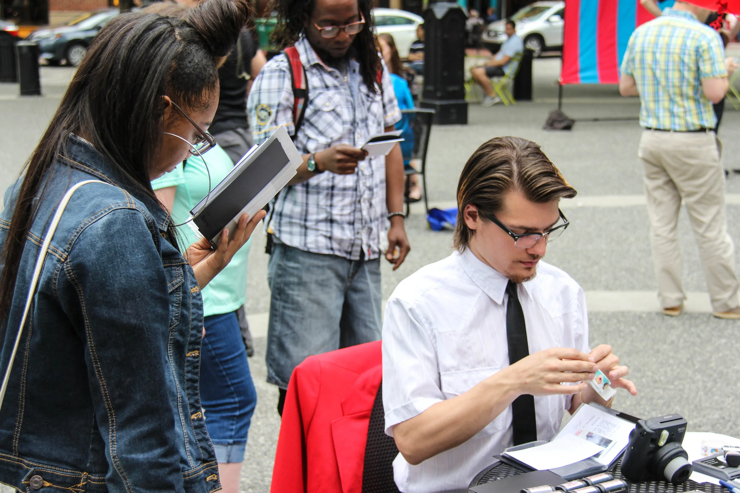 Sheryl Oring's assistant Robert Rose stamps a letter. 
