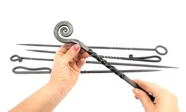 Anna Koplik_Fire Tools_w_ hands_steel_2025.jpg