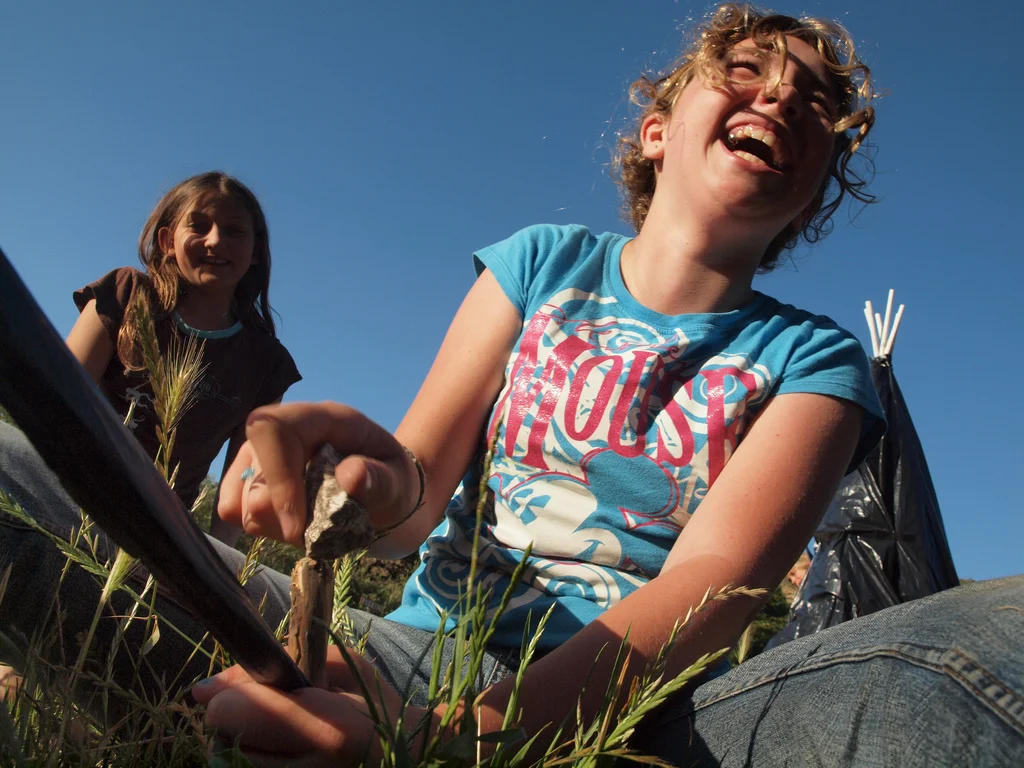 Two girls work together to solve a tricky problem