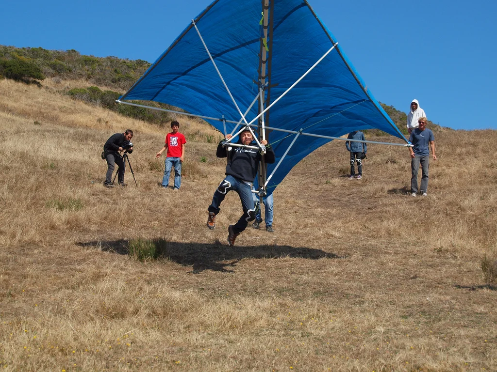 Kid flys on home made hang glider