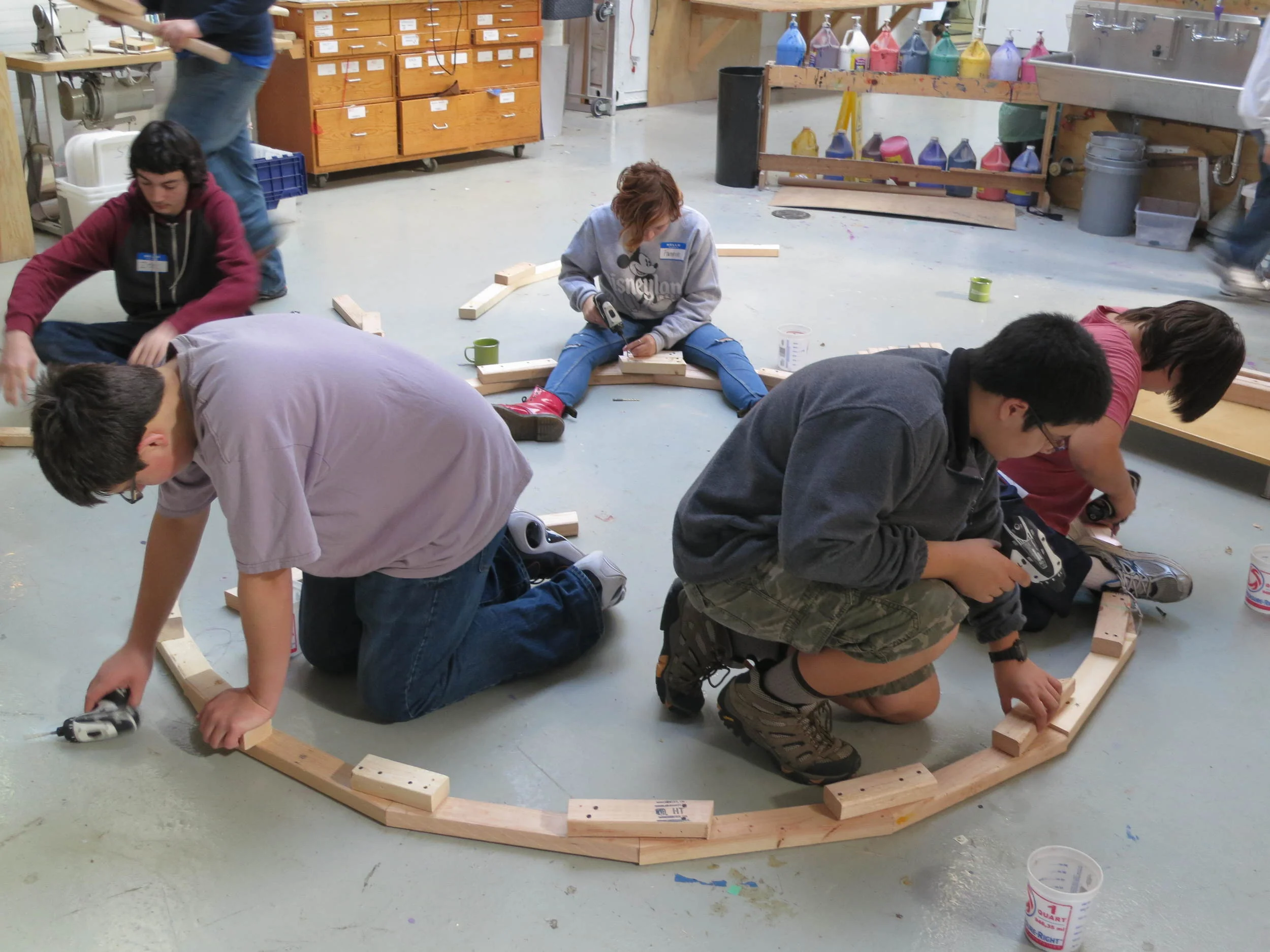 We assemble wheel segments and gussets into "two-zies", then "two-zies" into "four-zies", then "four-zies" into "eight-zies"....