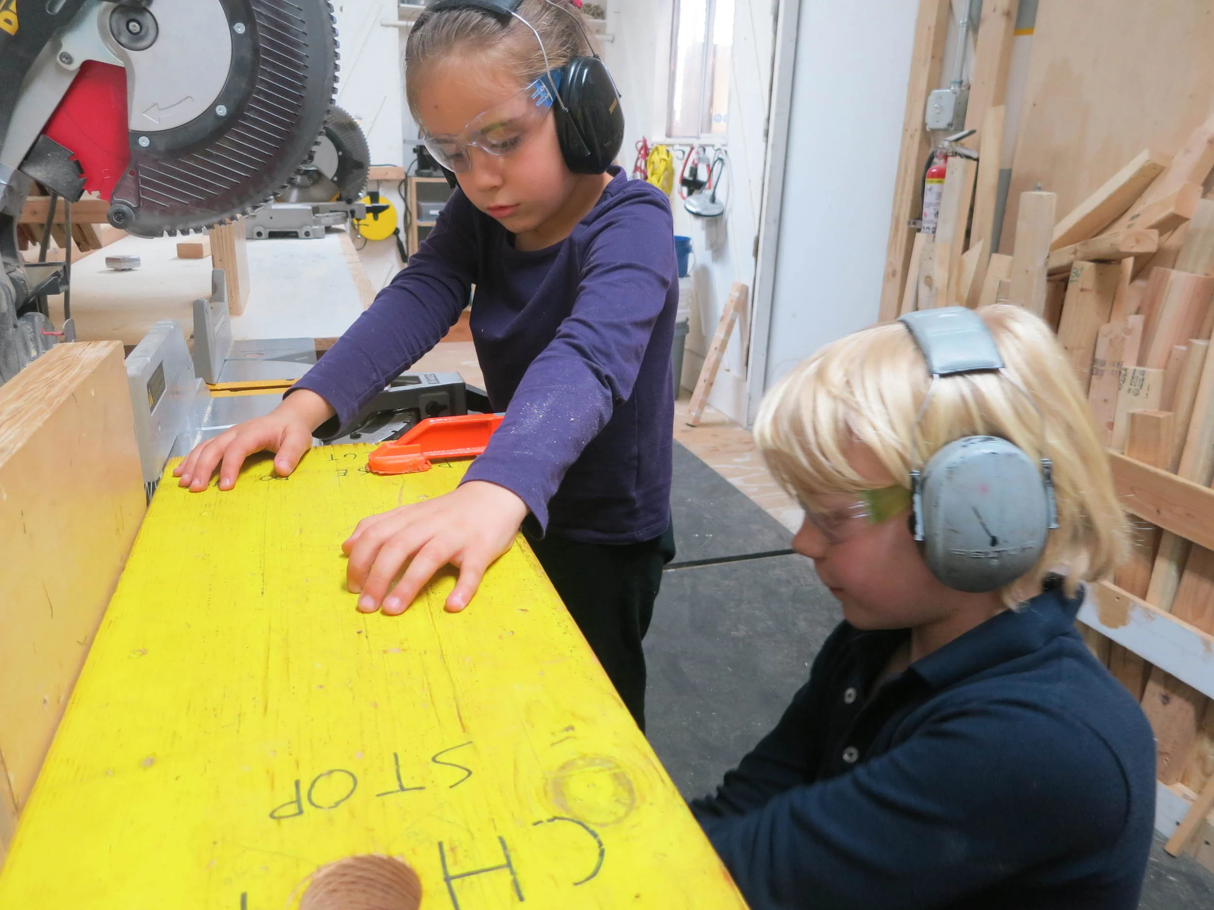 Natalia and Lincoln learn how the chop saw stop can be used to help you make multiple cuts of the same length without having to measure and mark each one.