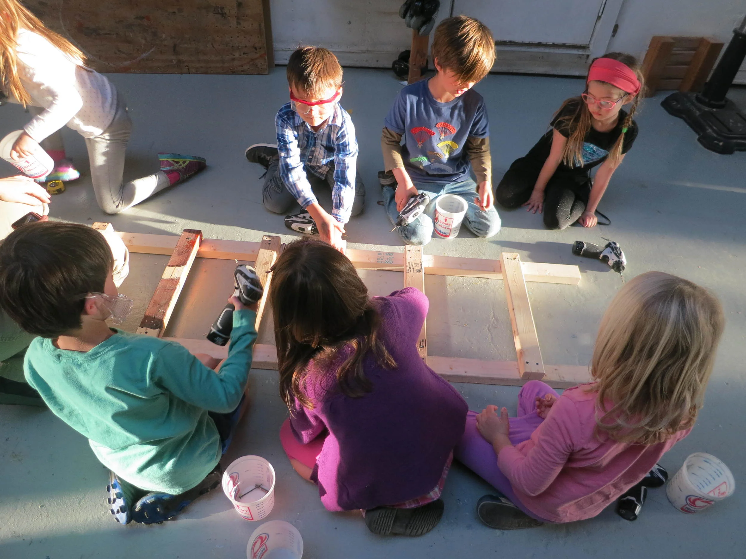 Putting it all together. With all hands helping we finished our ladder on the first day of building. Go team! 