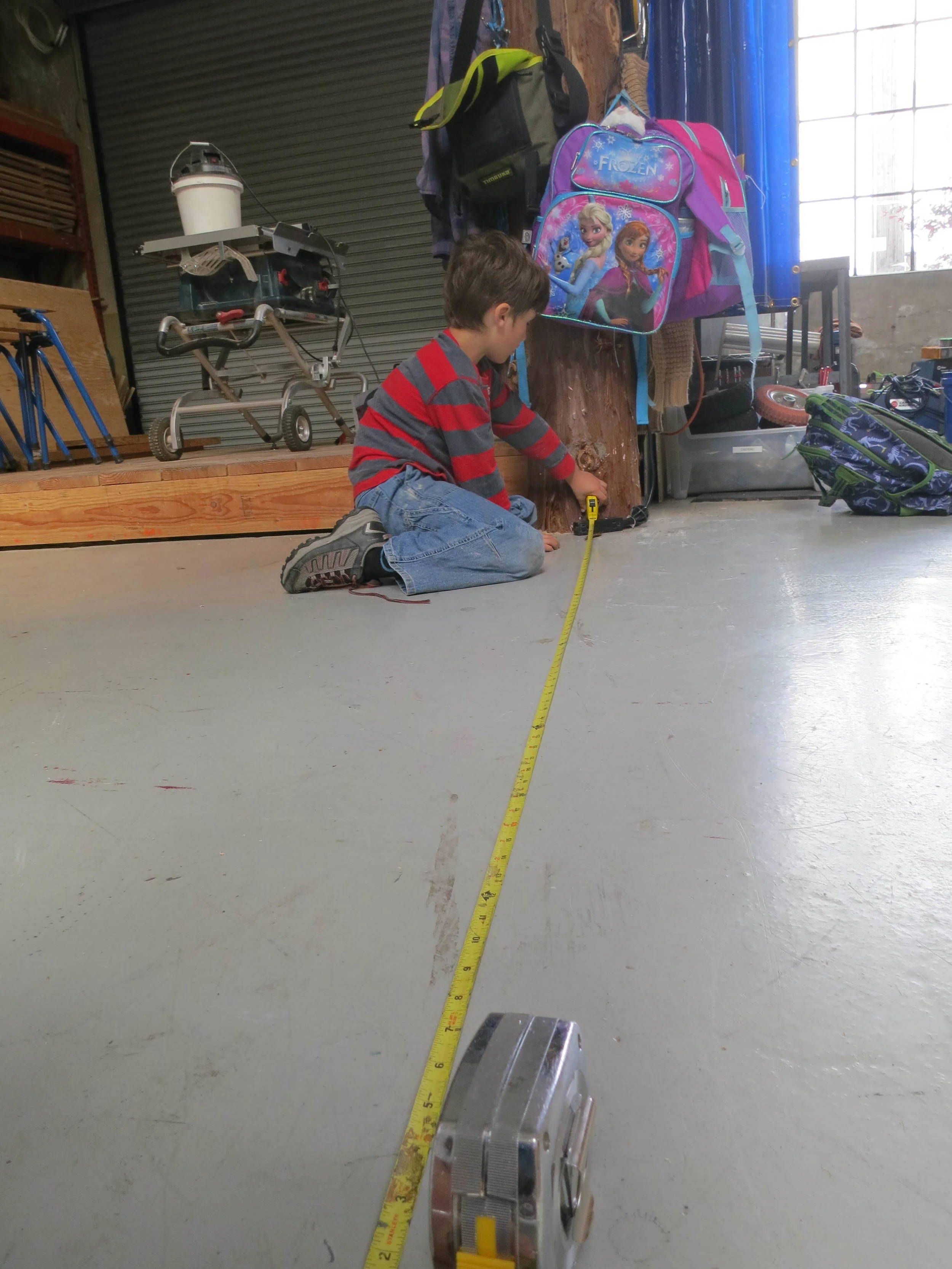 Isaac helps determine the length of track needed for the longest segment of the ball run. 