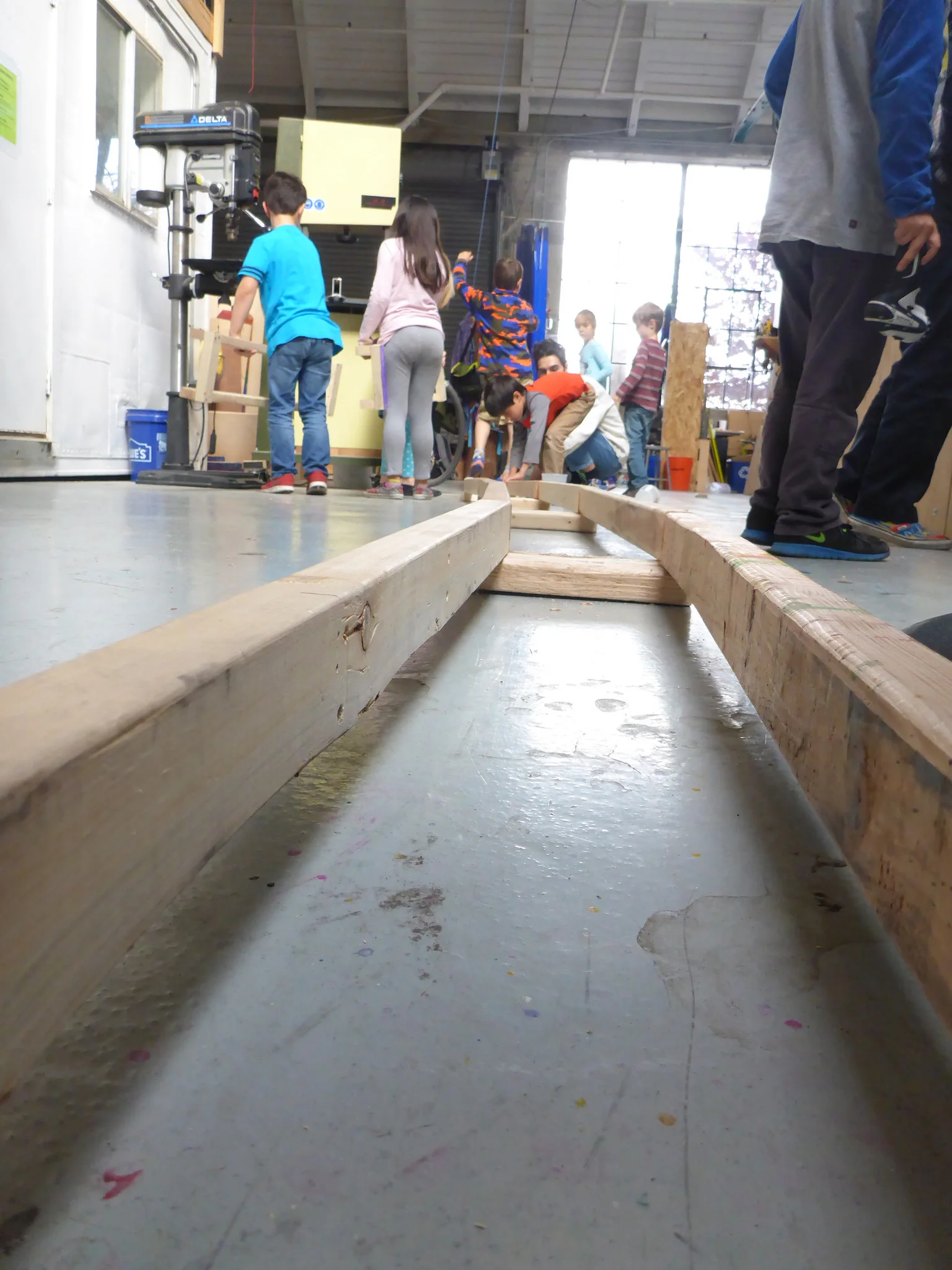 We pause mid-afternoon to lineup all the assembled track segments. Checking for consistency in track alignment and celebrating all our hard work!