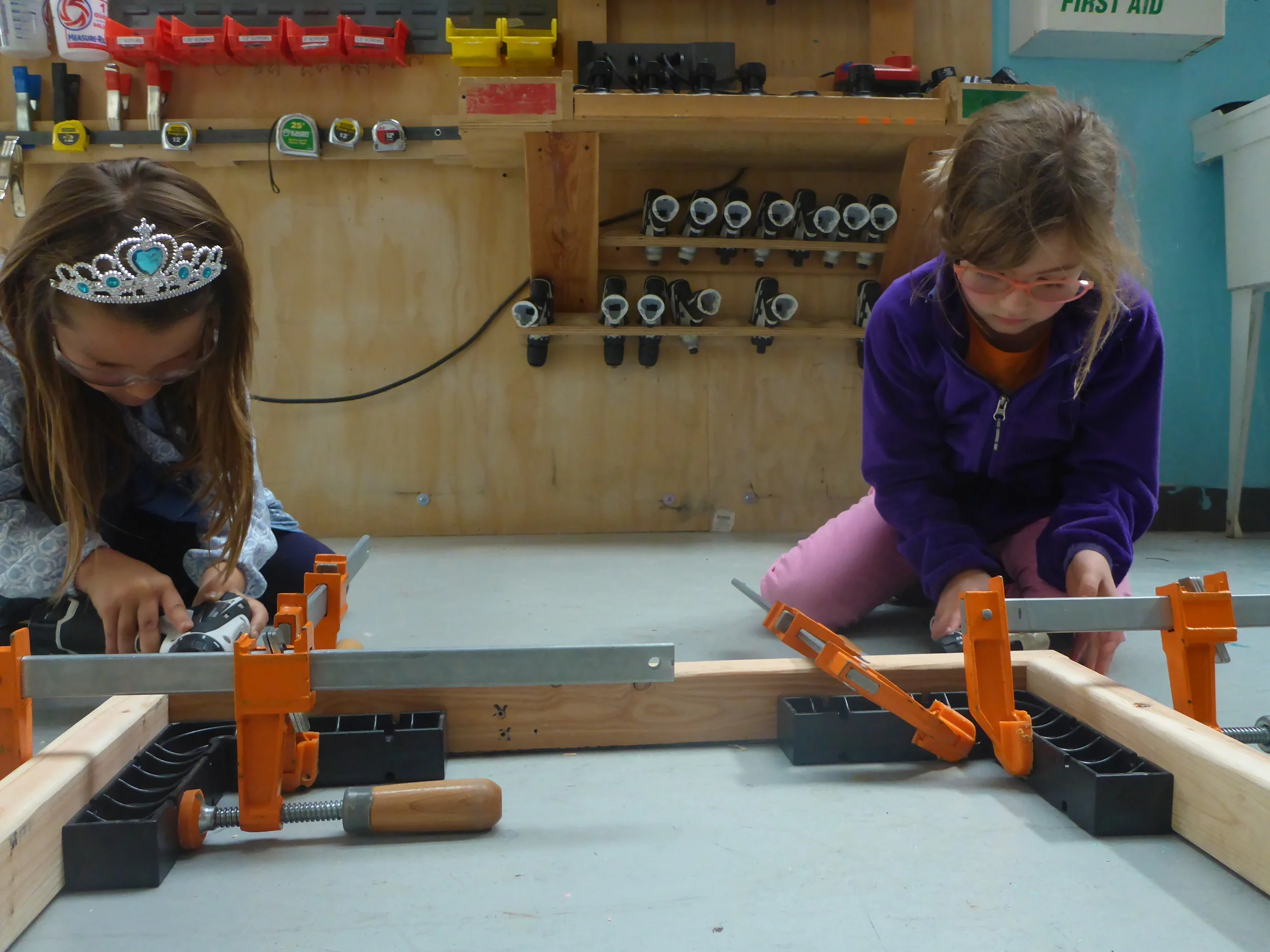 Some awesome team drilling / screwing together the base for our slide platform!