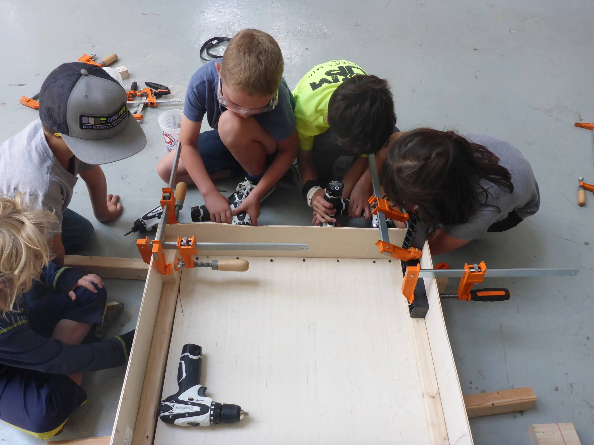 All hands on deck... err, truck bed... for clamping and assembling a place for the vehicle to store our shipping container. 