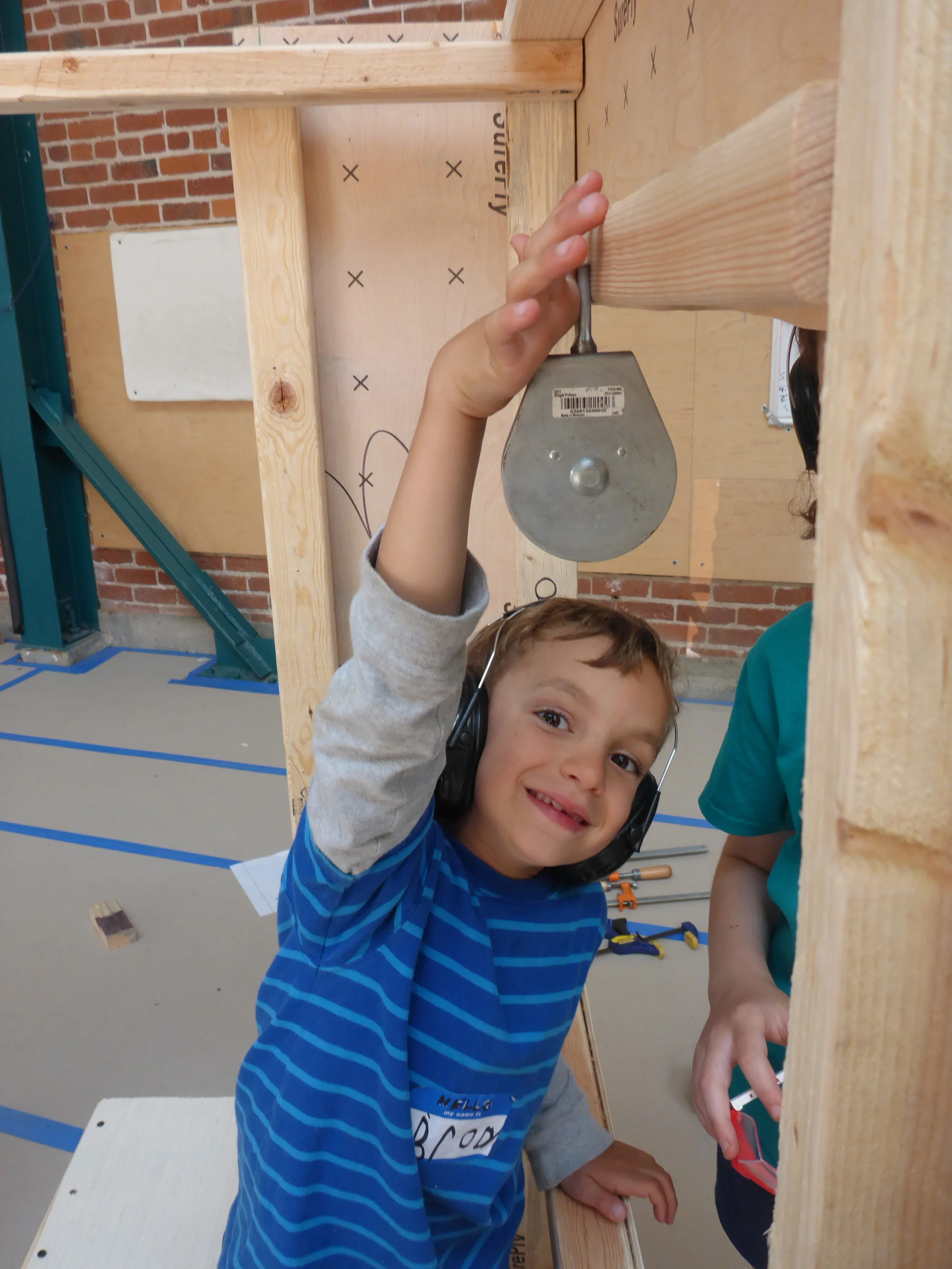 Brody demonstrates where the pulley on the toll booth gate lifter should be installed!