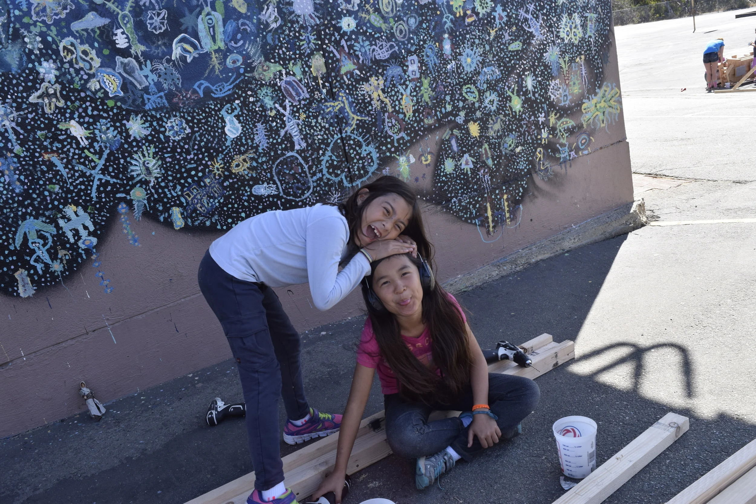 Teagan and Aime put together the track for the wheels. 