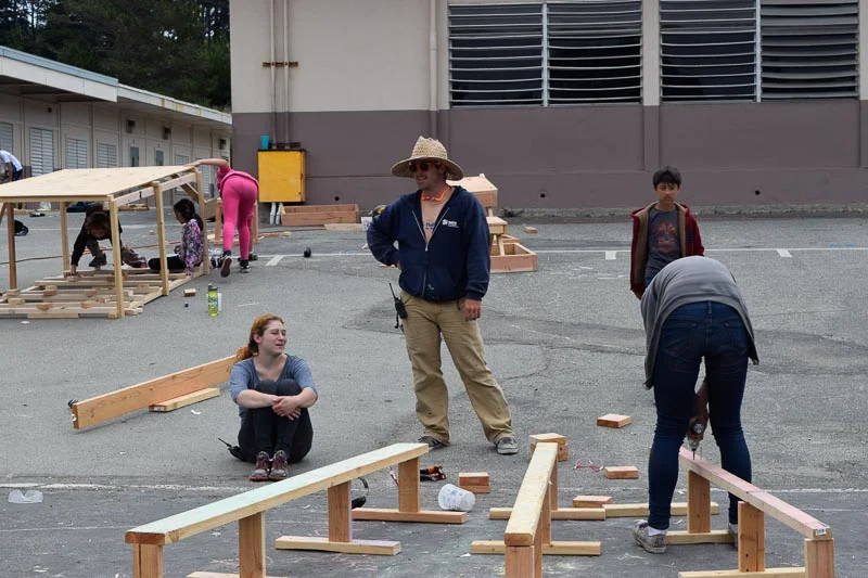 Rhody consults Sayer on supports for the balance beams.