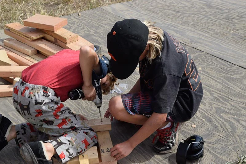 Winter and Sarah work on a corner of their structure.