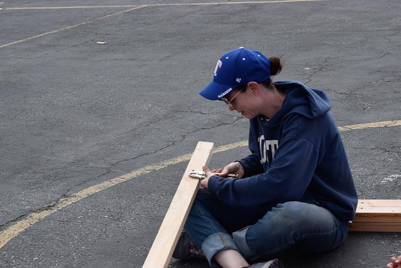 When screws are stripped, the only way to get them out is either hammer/mallet-ing them out, or with a vise-grip like the one Bridget is using. 