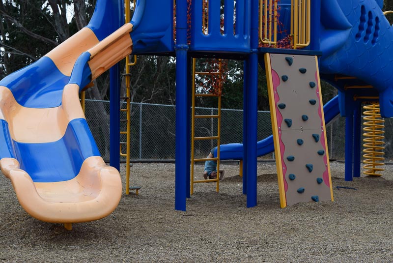 Kavan is hanging off the edge of the slide.