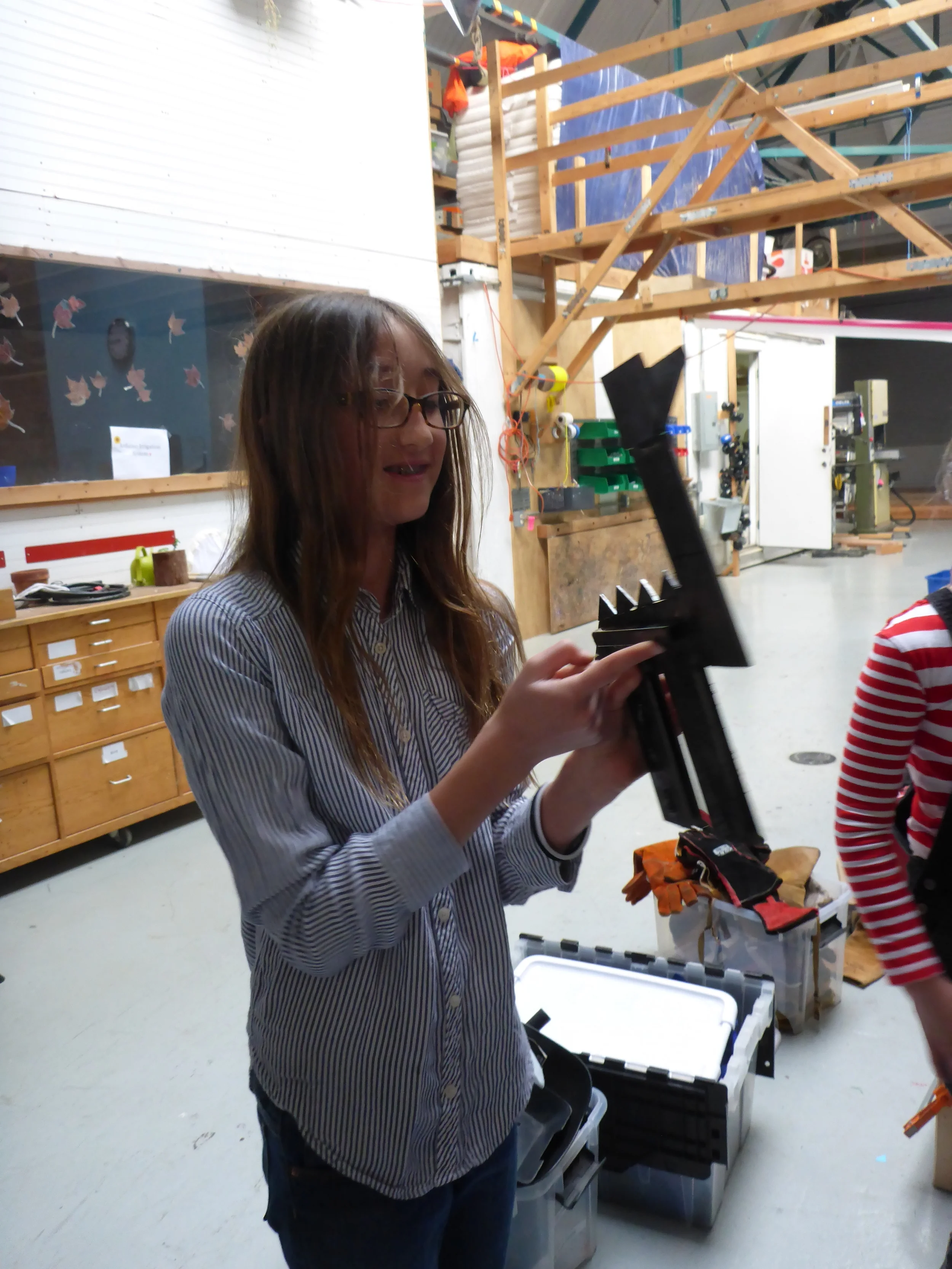 Anastasia shows off the dragon she made! At first, she thought this project might be a little too big, but with a boost of confidence from some collaborators, and some outside the box thinking about the design, she really made it happen. We can't wait for her to come back to attach the wings!