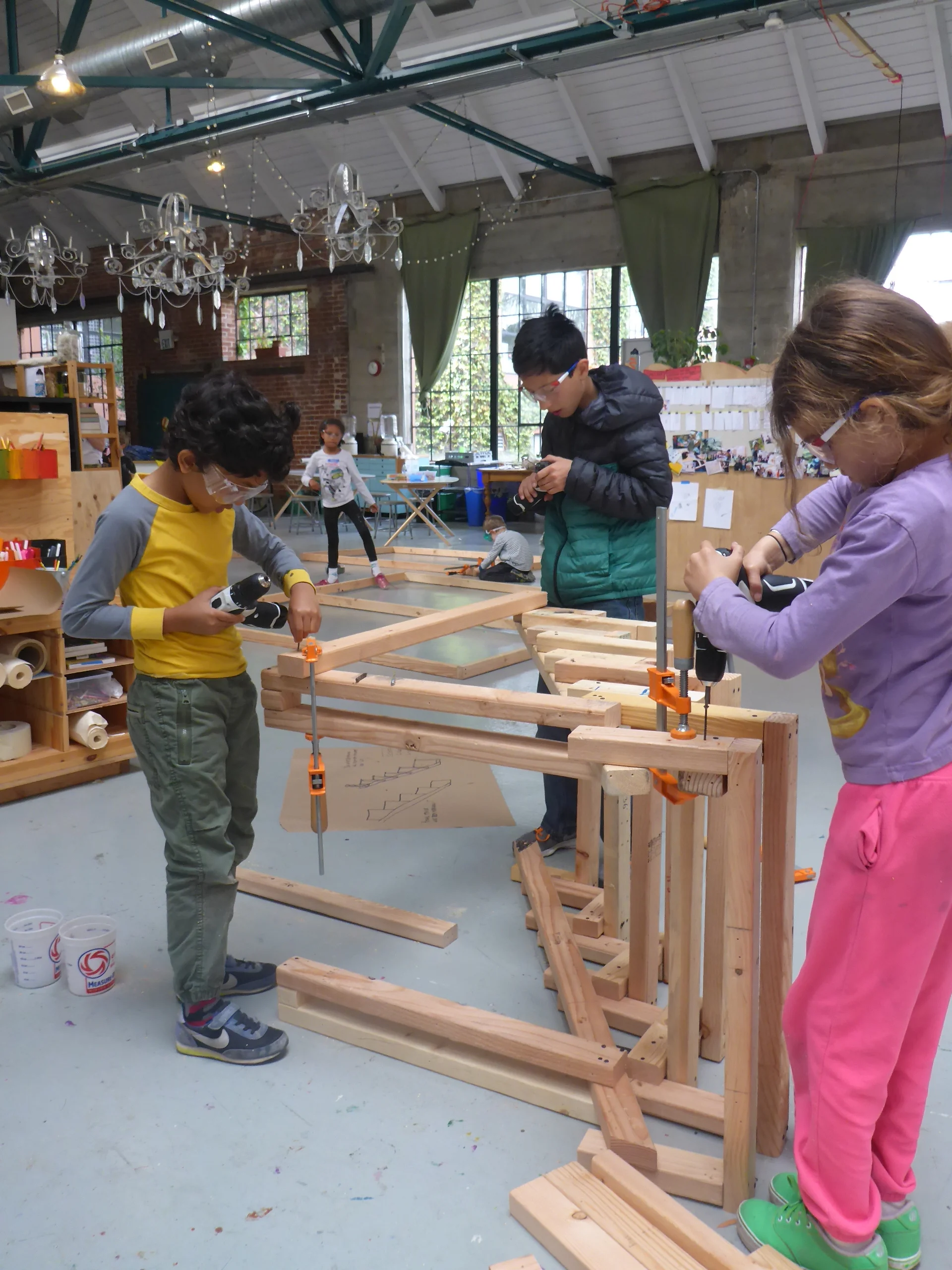 Gautam, Alex and Lana put leg supports on their stairway!