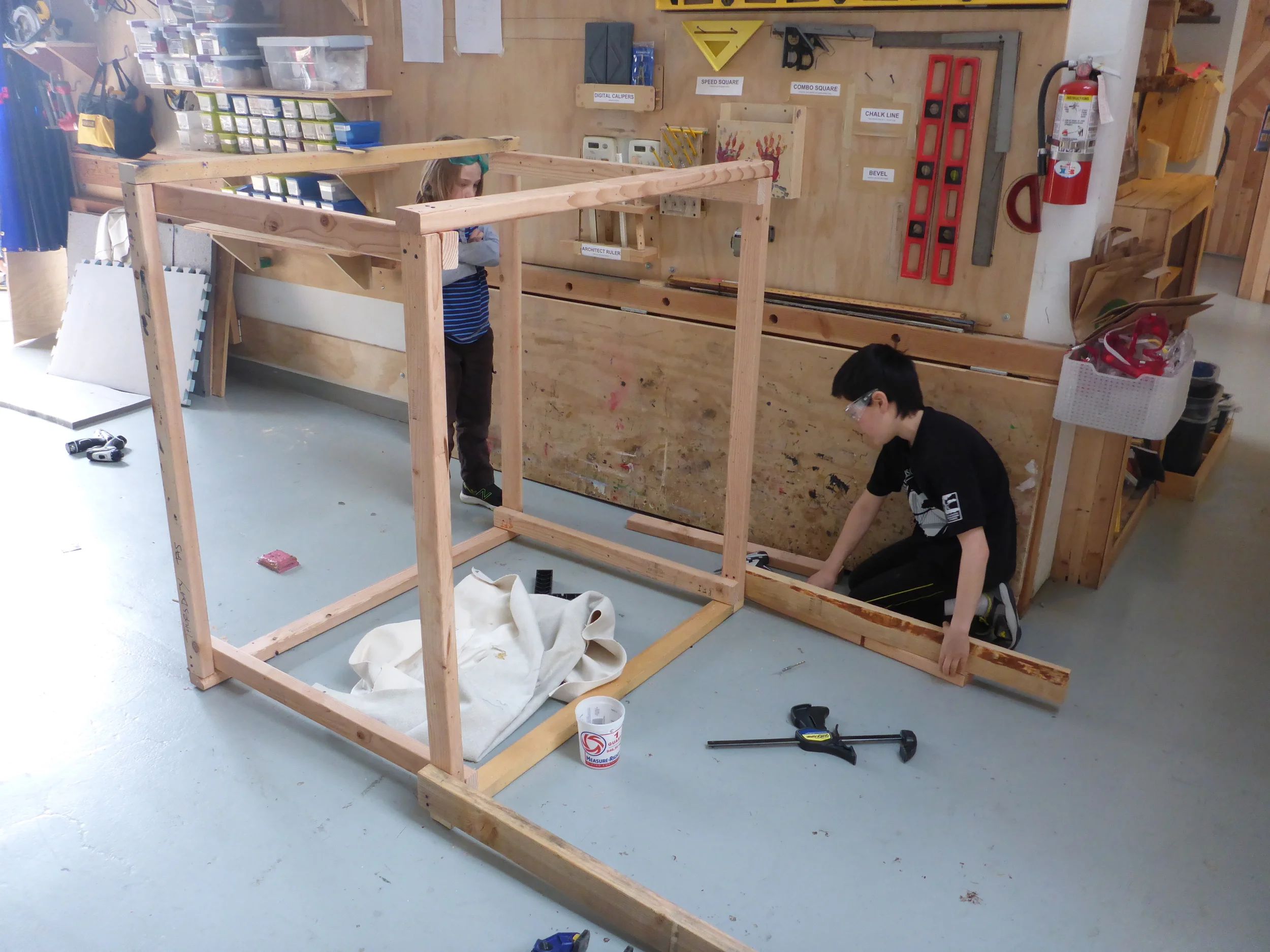 Ayden and Eli finish framing the Fruit Stand.