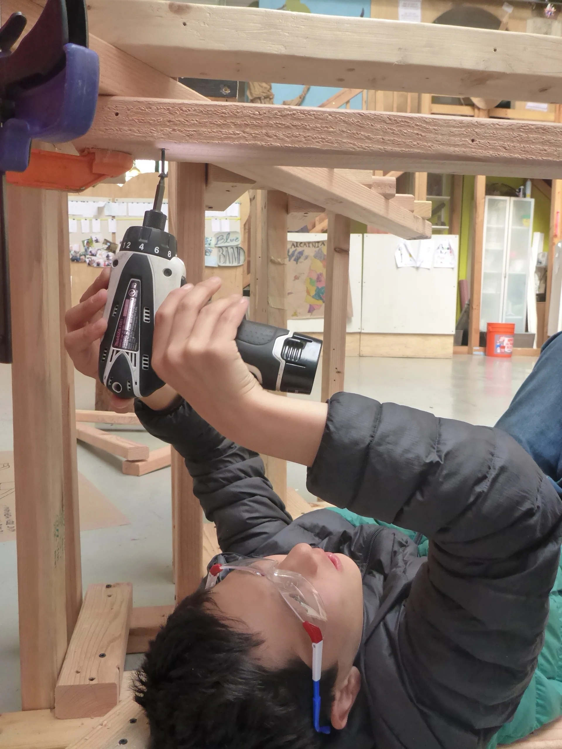 Alex does some upside down assembly.