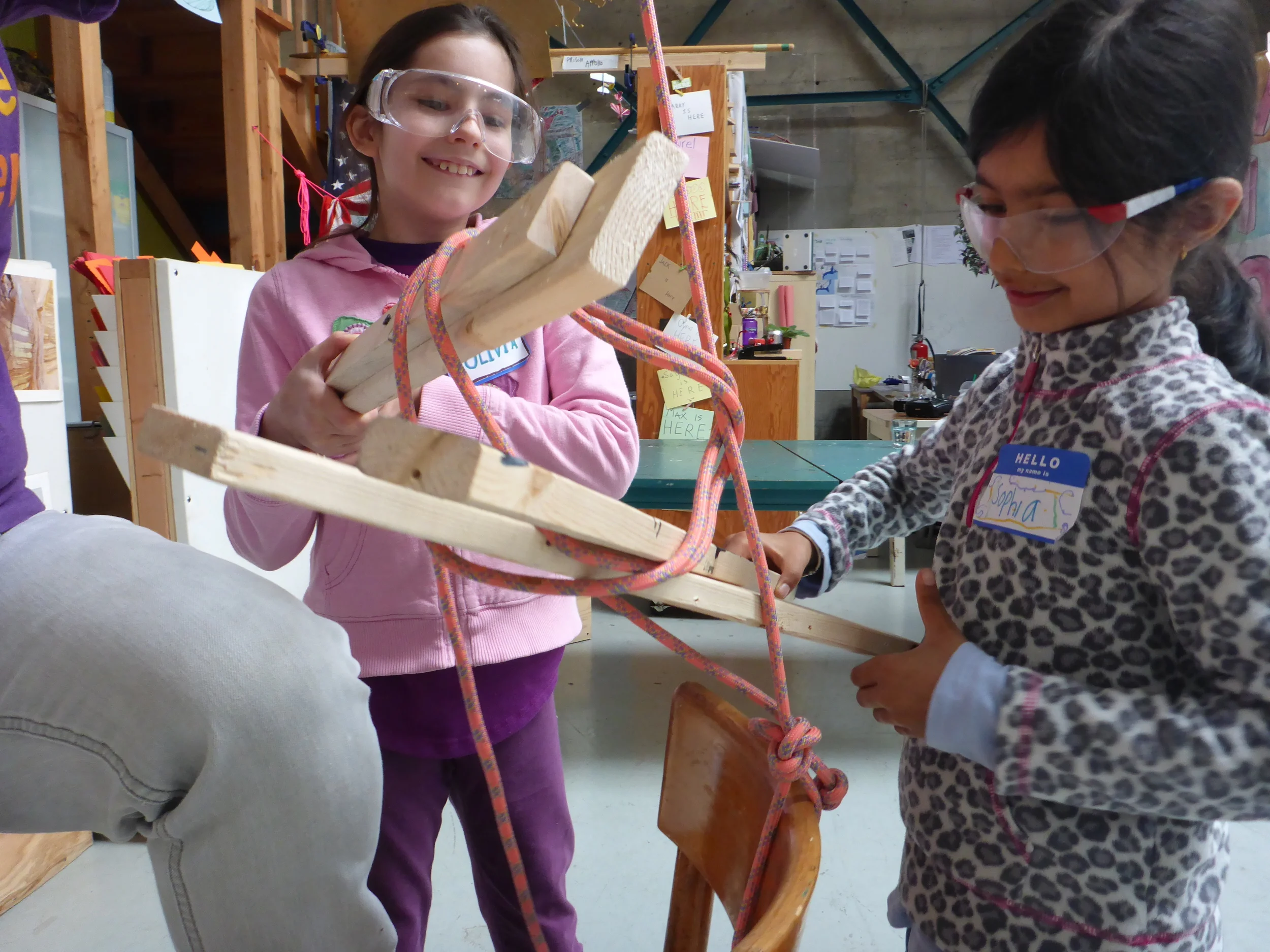 Olivia and Sophia became veritable pros at tying knots using long sticks!