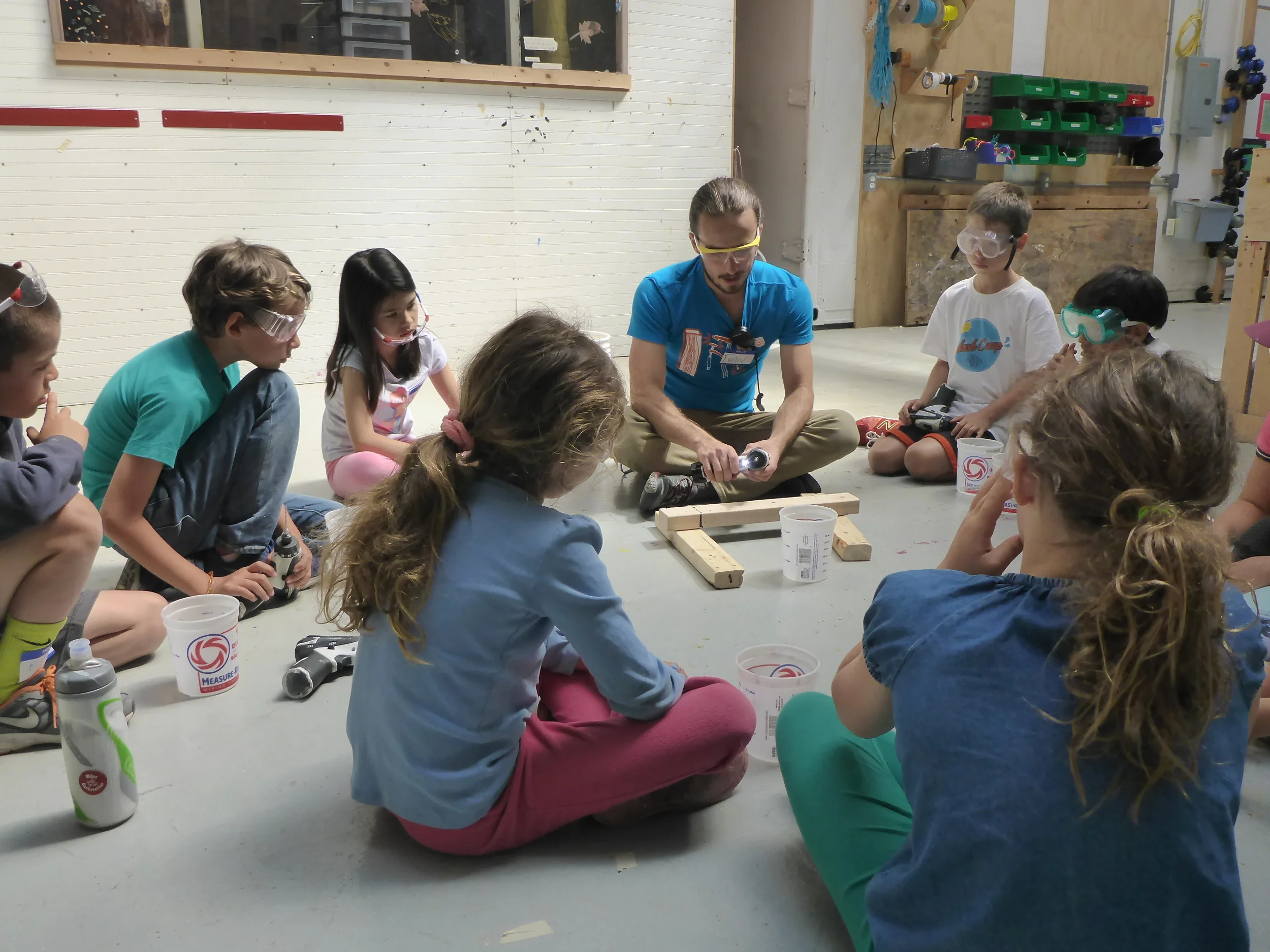 Tinkerers learning to use the drills