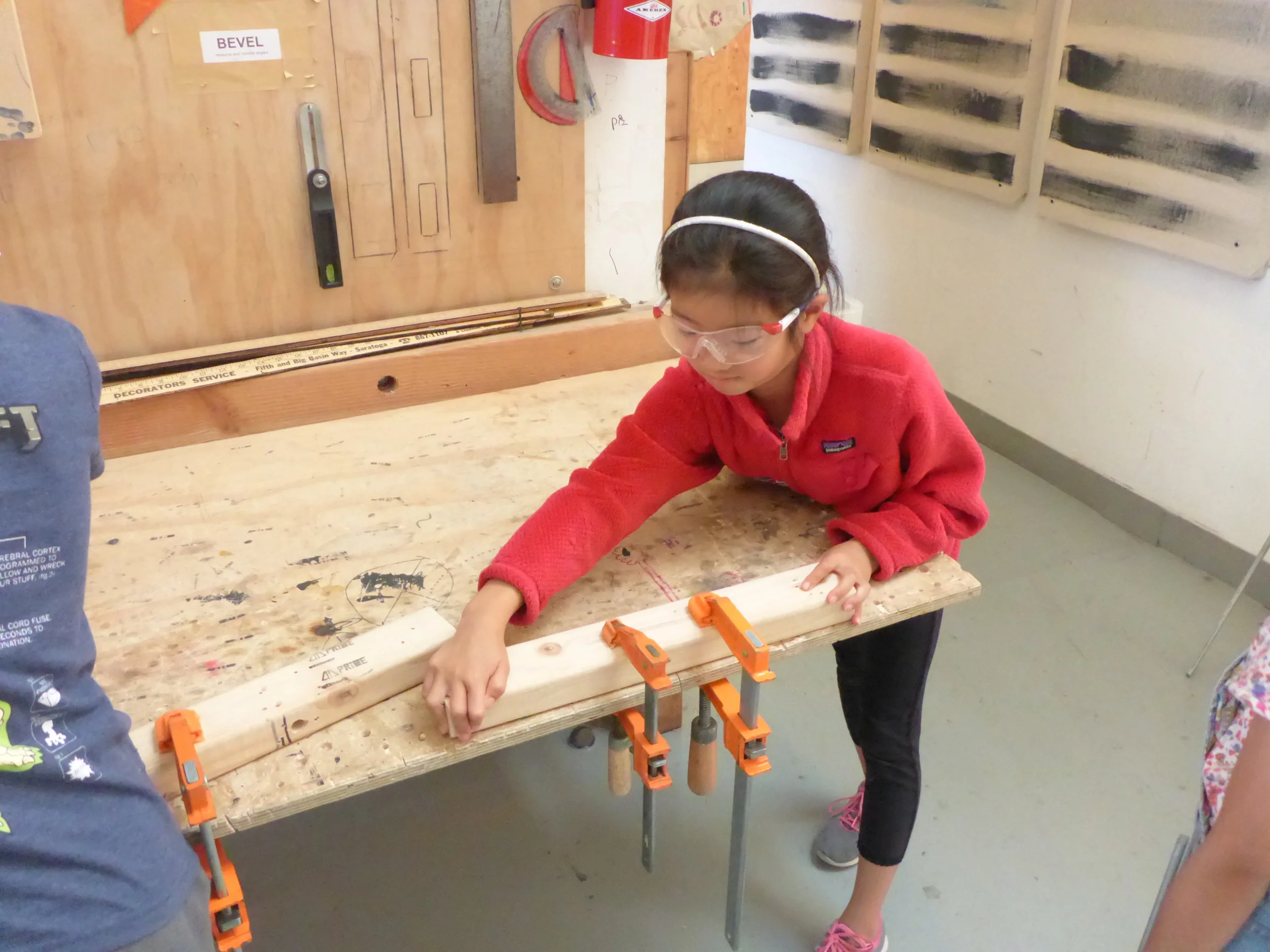 Tinkerers learning to use the clamps