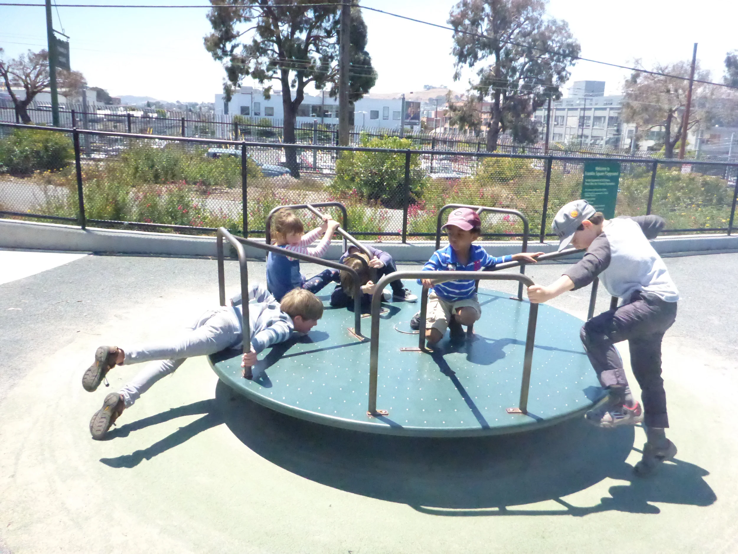 We spin! The merry go round is a definite park time favorite with this bunch of kiddoes.