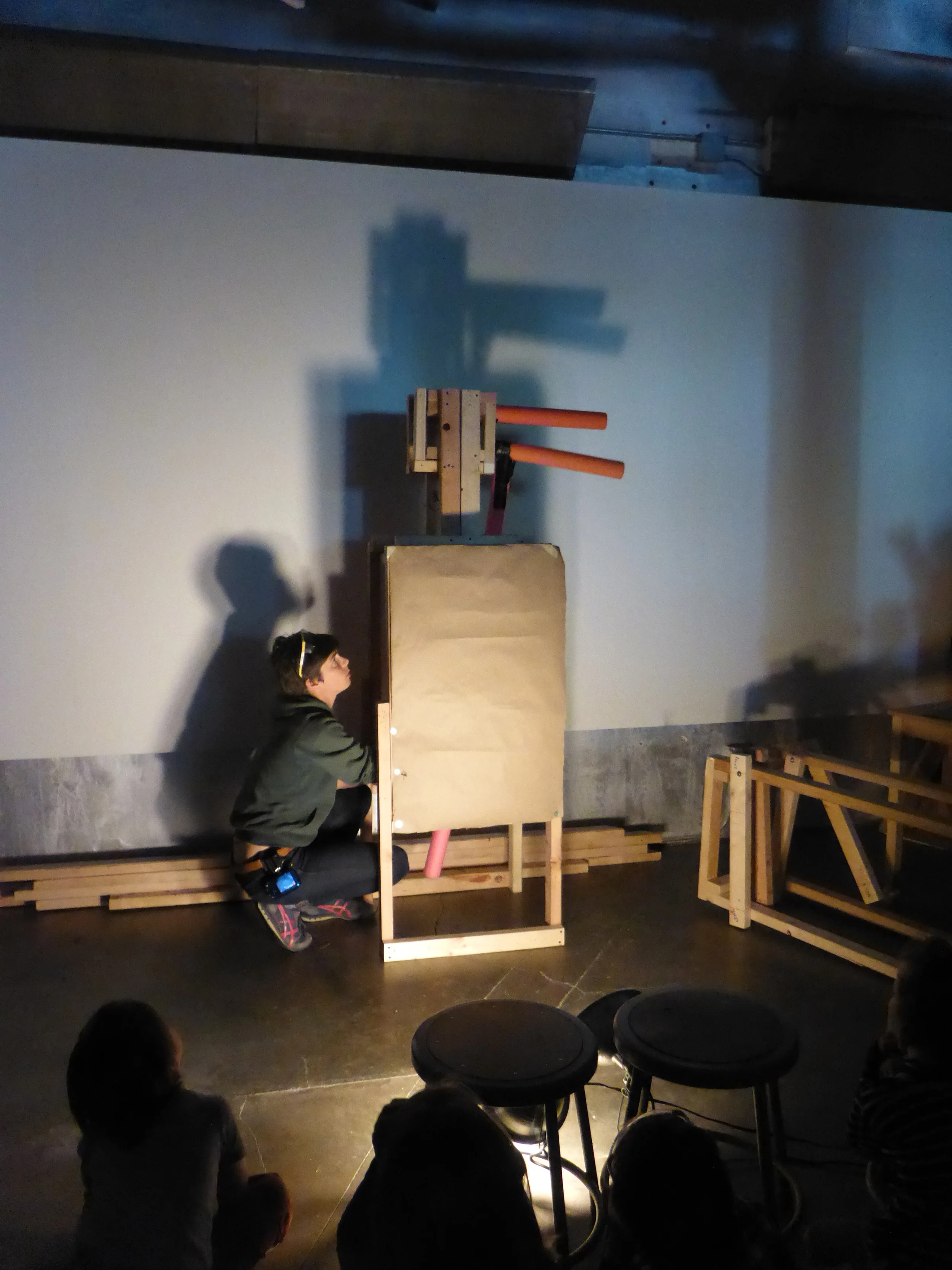 Caroline demonstrates the mechanics of the bird's beak and takes suggestions from the campers on how to improve it and what are the priorities for the next day. 