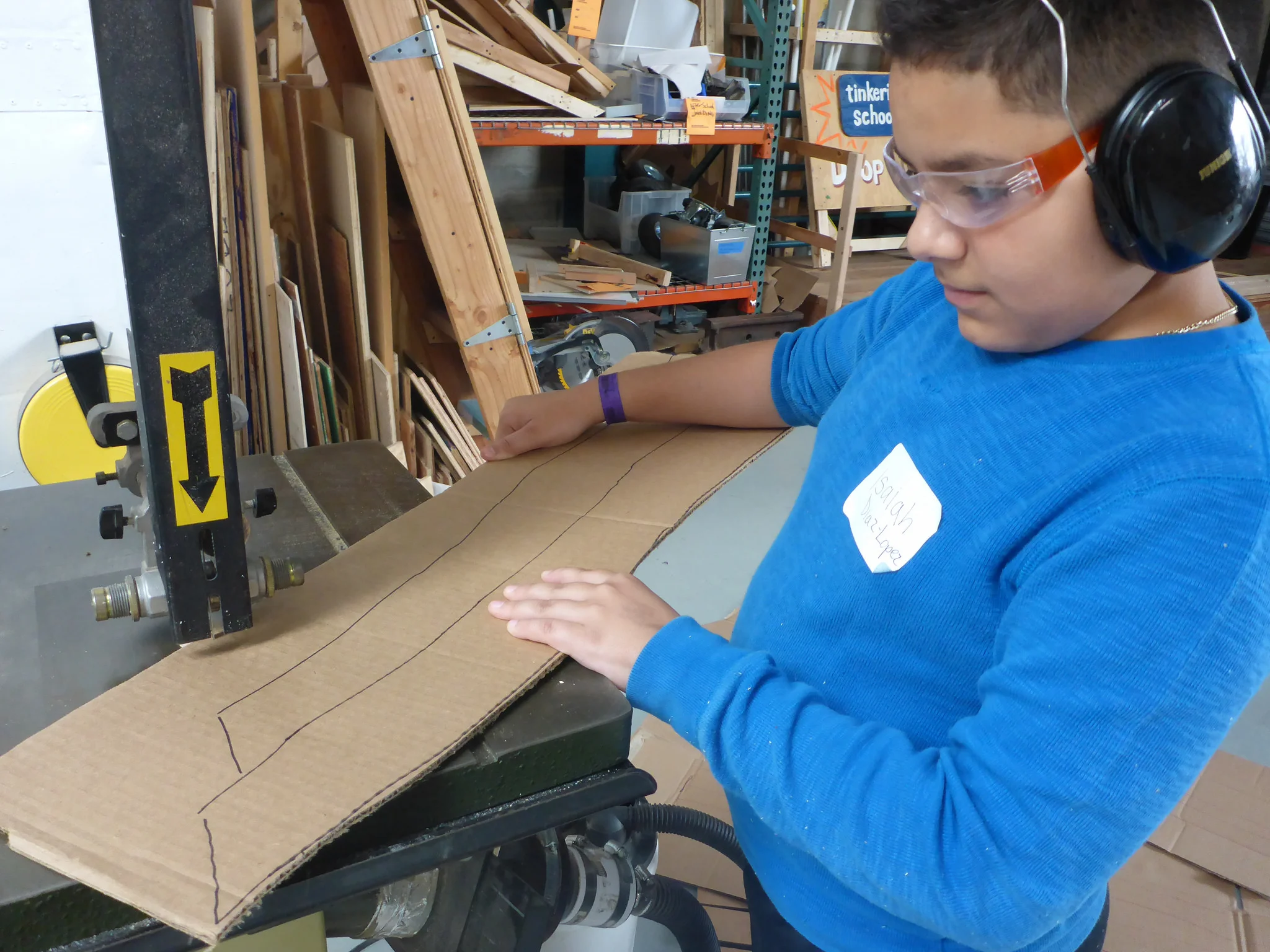 Isaiah cuts the angled tips out.