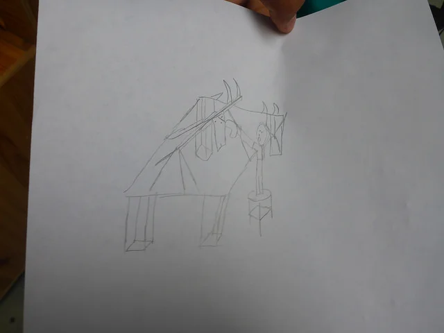 Here is Maanasa's drawing of herself trying harder than usual attaching the wings, up high, with tricky washer/screw assemblies.