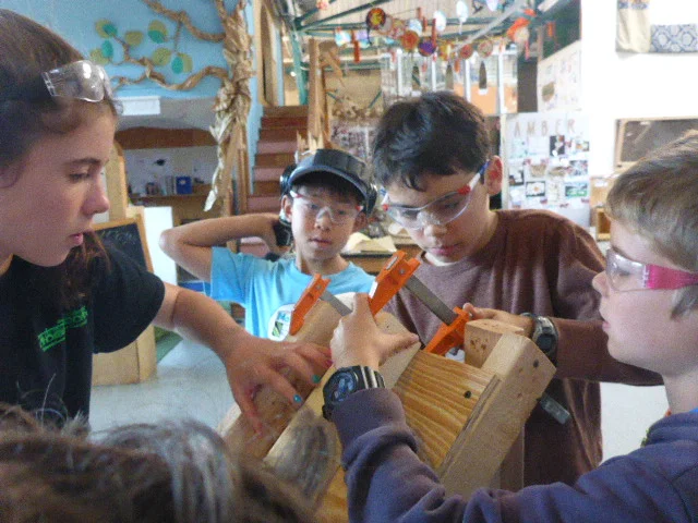 All hands on deck as the ramp team clamps down some railing to prevent the giant coin from toppling over. 