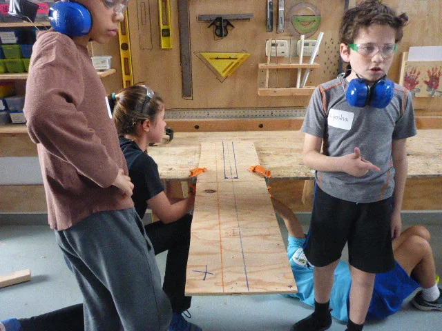 We set up some really complicated bandsaw cuts today. The team worked together at the last minute to cut a coin slot from a single piece of plywood. 