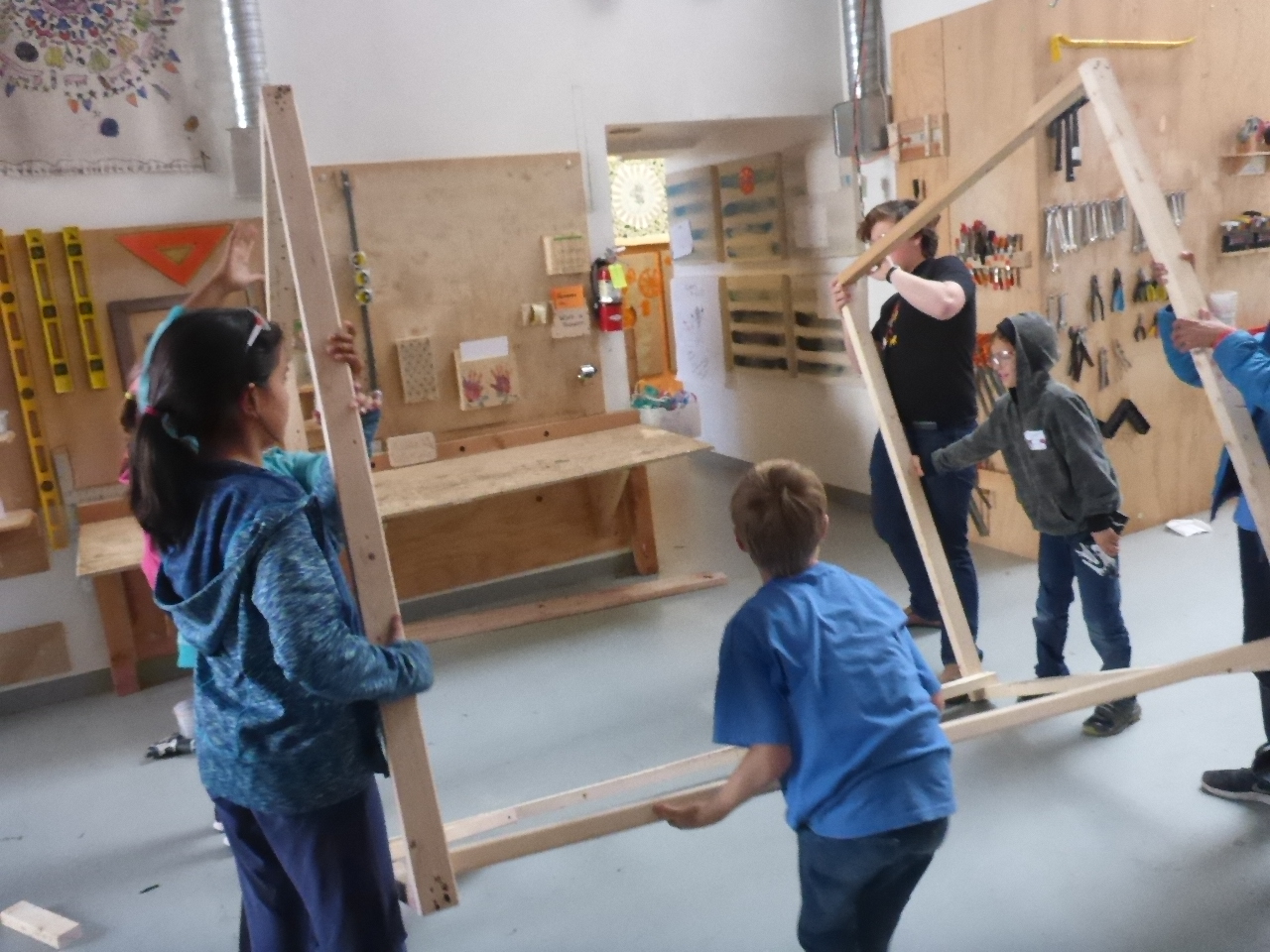 One team worked on making a giant cube for all the vending machine components to fit inside. 