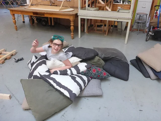 Jordan gives the pillows a quality control test.