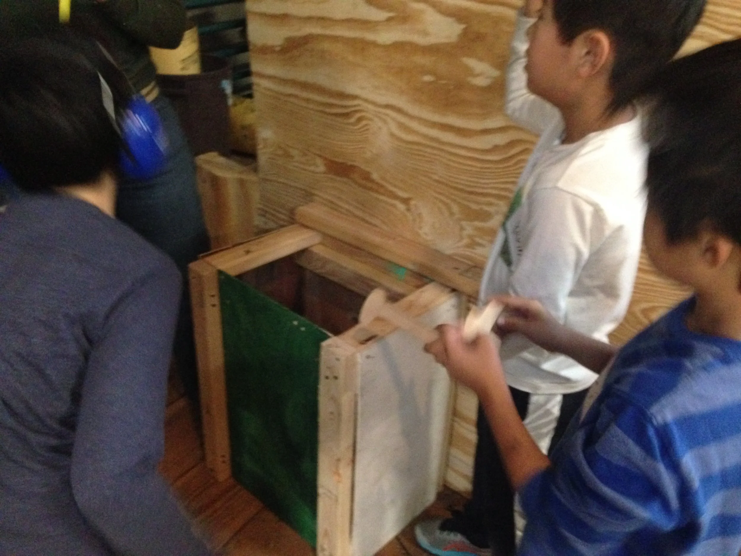 Above, this group deliberates how to attach the enormous heavy nose to Potato Head's thin plywood face. It was very heavy - in no time everyone agreed that additional support was needed to ensure safety!
