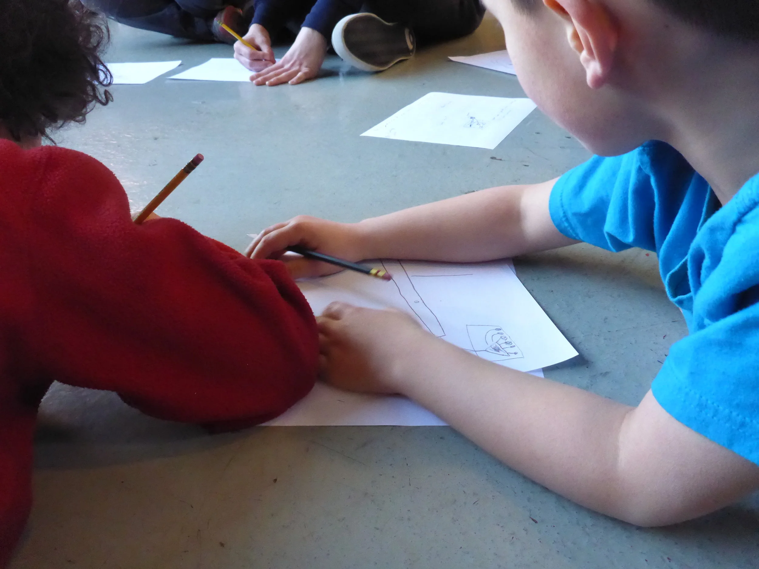 After tool training, each team brainstormed designs and ideas for how to build the machines. 