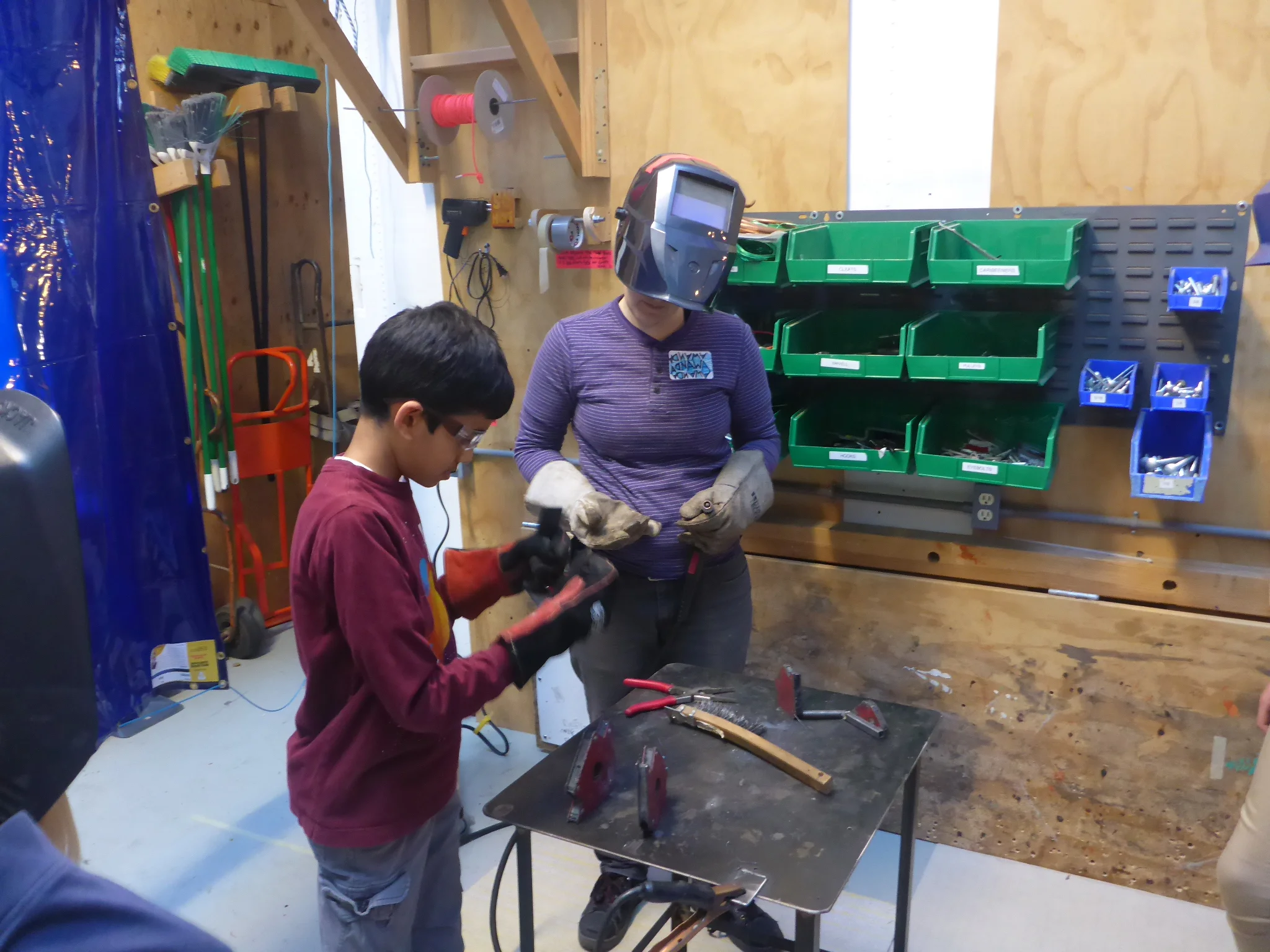 Rajan gets ready to weld on his house. 