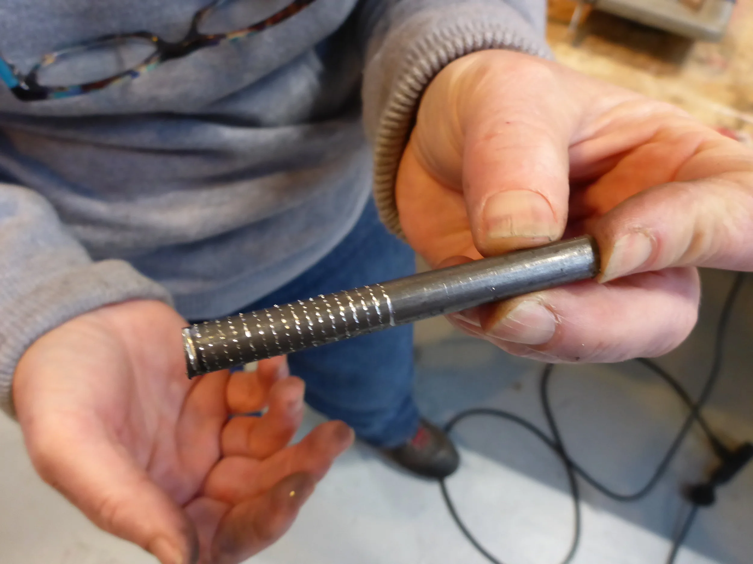Karen made a really beautiful mistake when the round piece she was cutting wasn't clamped tight enough and instead of the blade cutting it spun the piece around and marked a spiral down it's length.