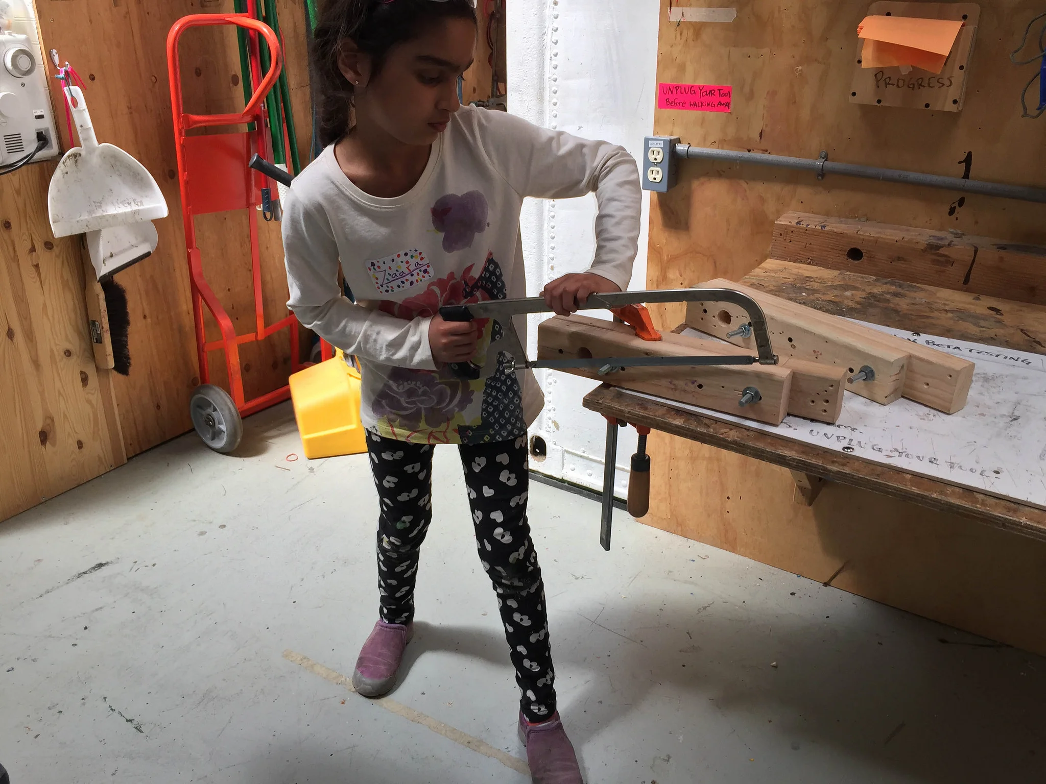 Zara cuts off some protruding rod that will prevent the steering from working.