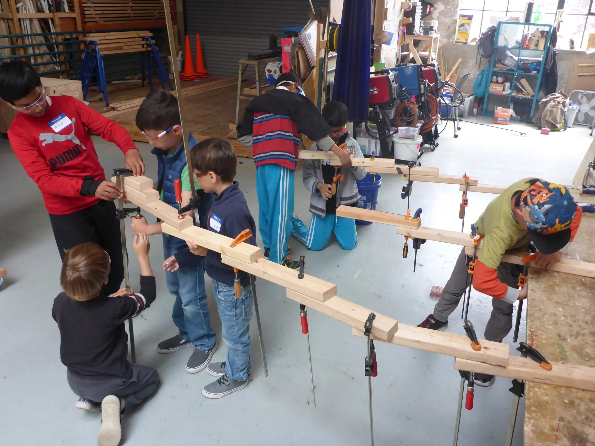 Clamp practice then evolves into silly temporary structures that stretch through the shop and then are carefully deconstructed.