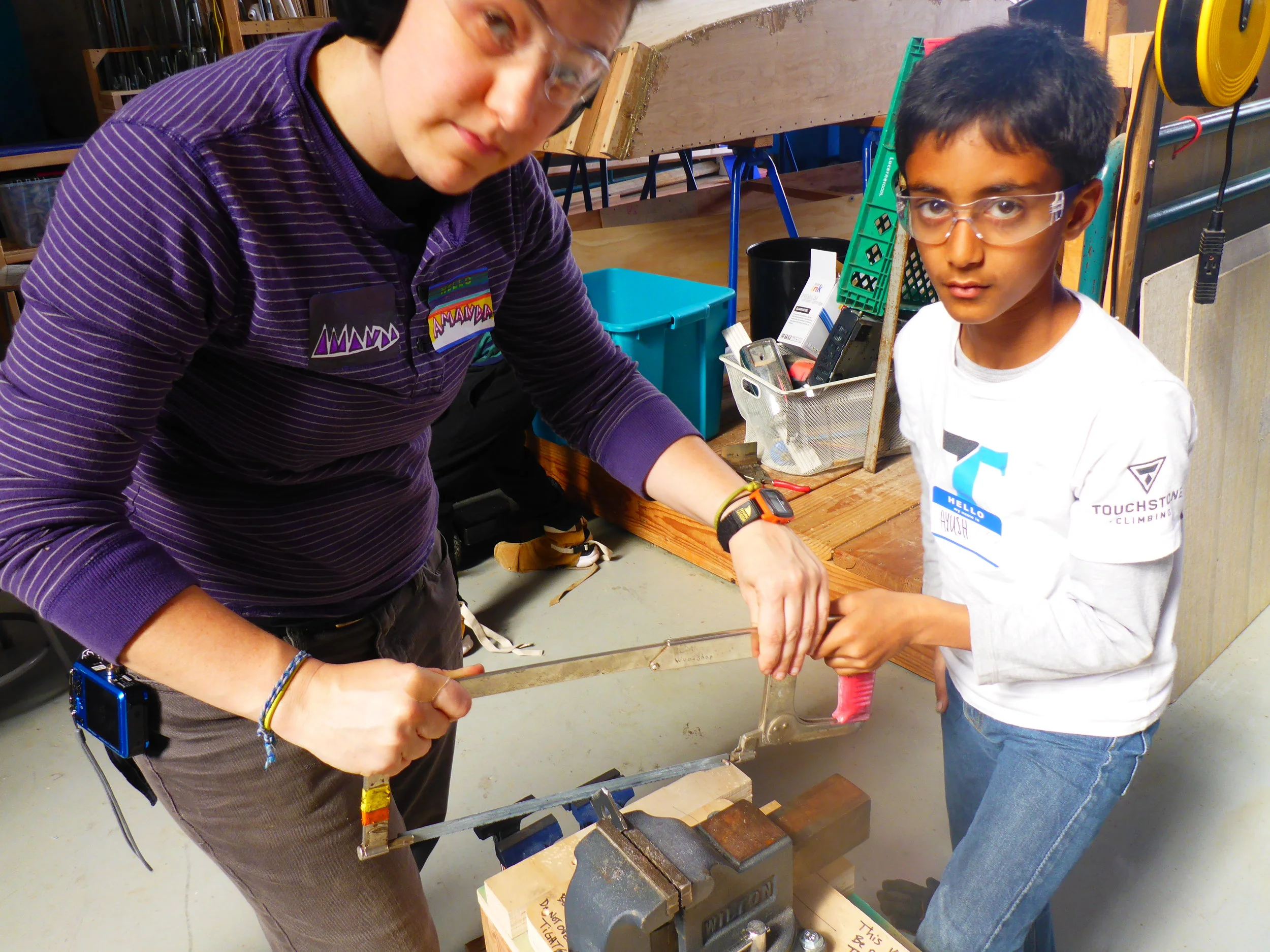 When the going gets tough, the tough get a hacksaw. Amanda teaches Ayush how to start a cut on using a hacksaw. His pieces was too small to use the plug-in tool to cut it, so these finishing details had to be done by hand.