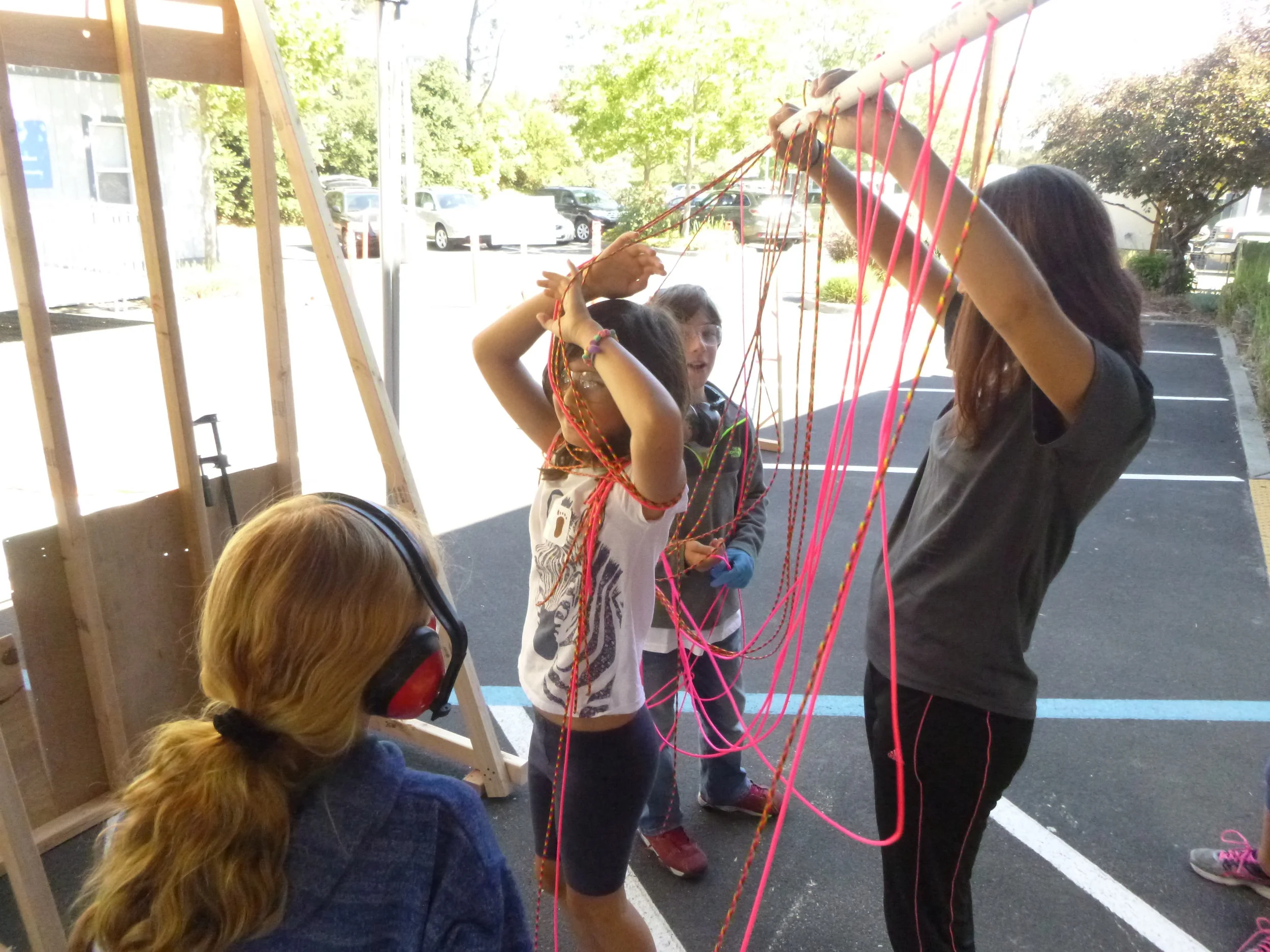 The wash station team decided to use paracord and PVC to simulate running water. We quality tested the mechanism to make sure it felt like water on your face as you walked through. Quality Test Passed!