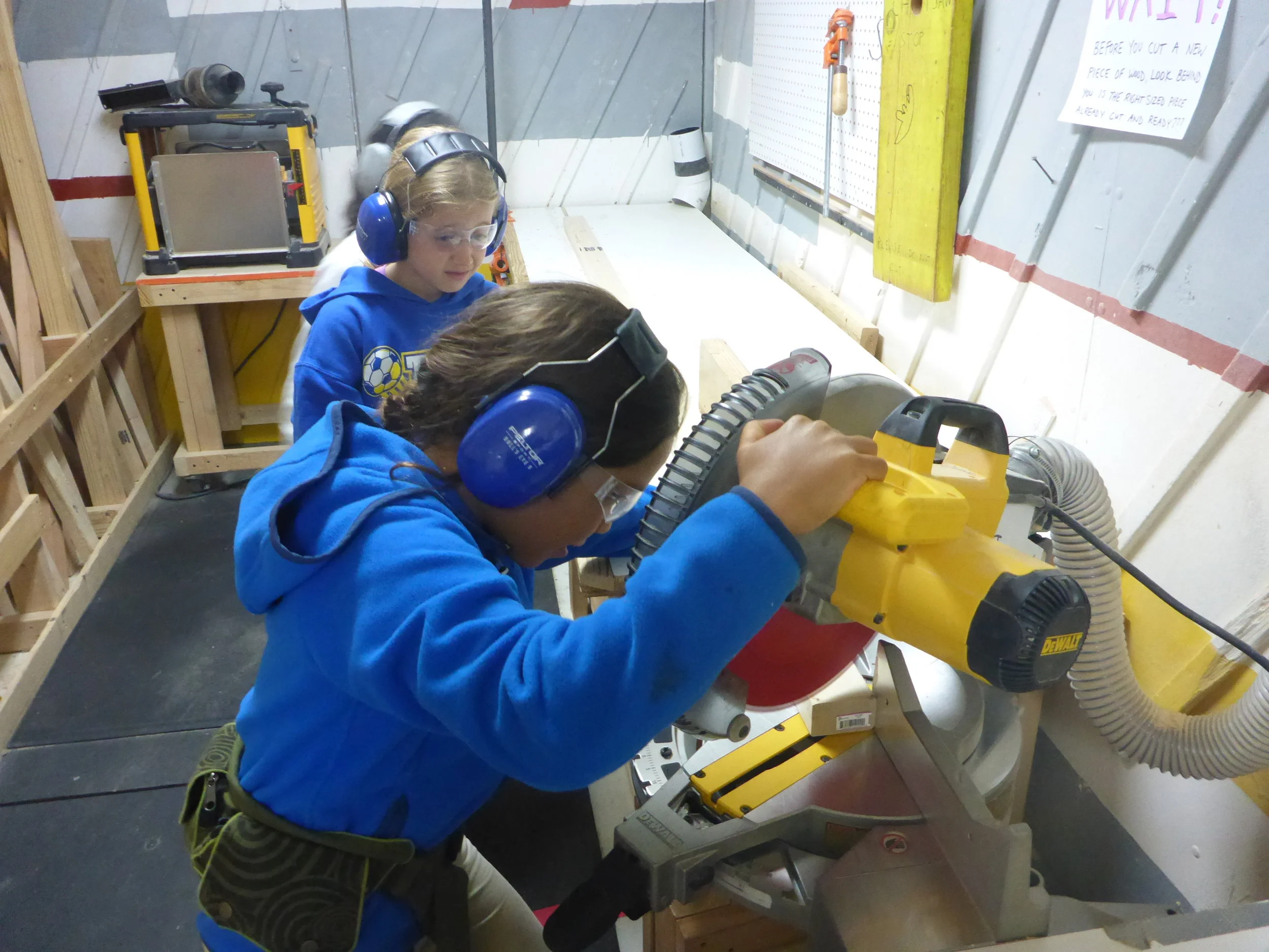 Camilo cuts an 8' board with a 30d miter. The truss bridge group hit the ground running this morning! They ended yesterday with such a solid plan for how to build their bridge, everyone felt ready to go this morning.&nbsp;