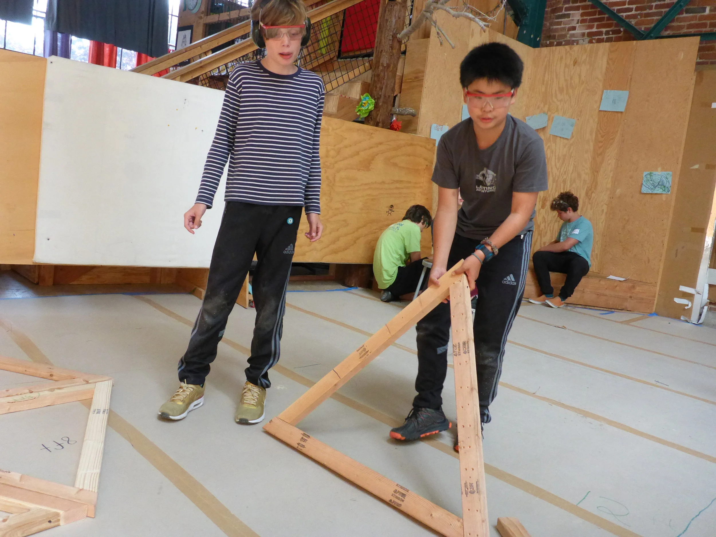 Isadore and Peter start to stage some of their equilateral triangles, while they figure out how they'll put them together to make the dome.&nbsp;&nbsp;