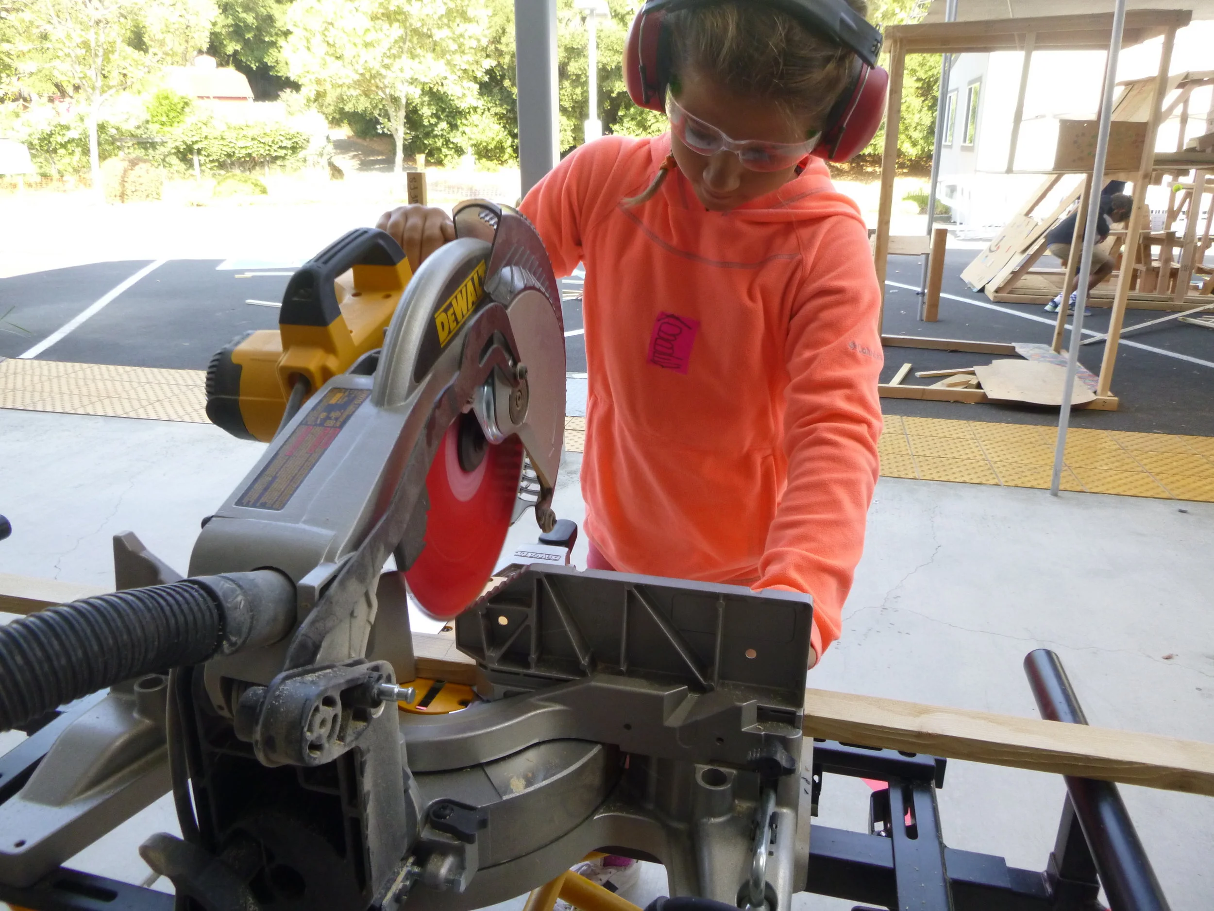 Abbey sawing away. The kids got a LOT of practice this week - we used a ton of wood! 