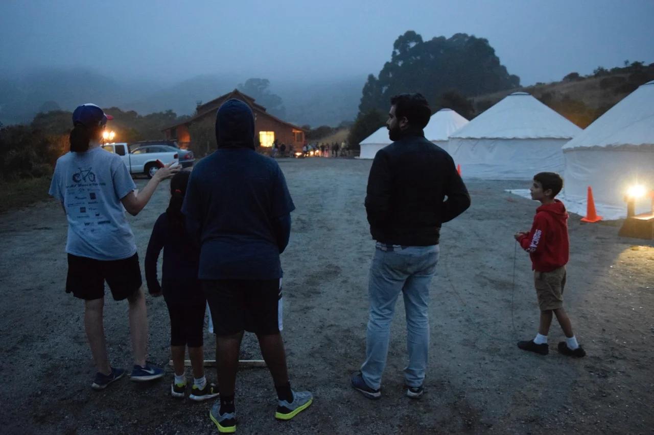 A team waits on one side of the parking lot for the message to be transmitted from the opposite side.