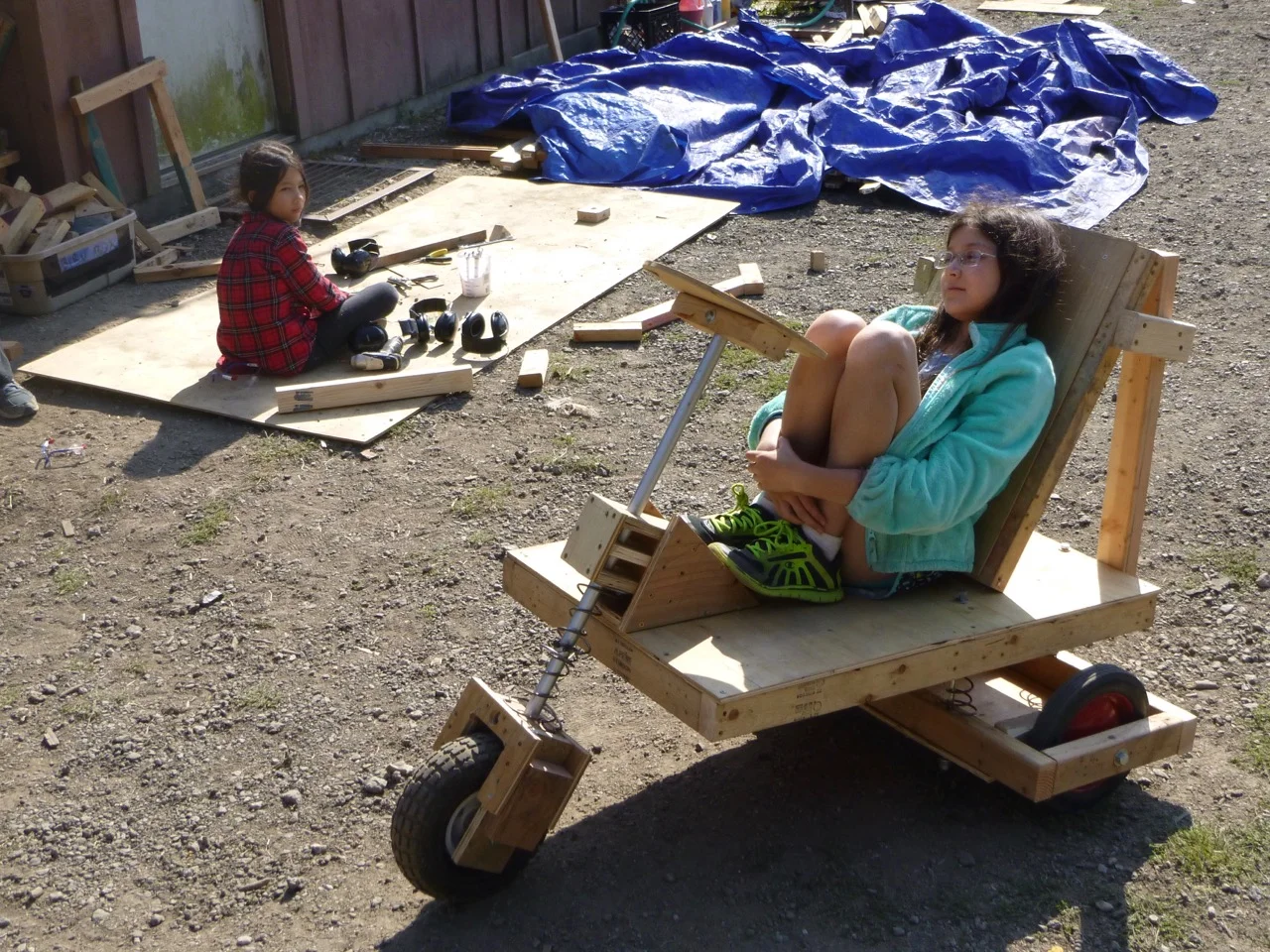 Trinity gets comfortable on Team Piki's cart.