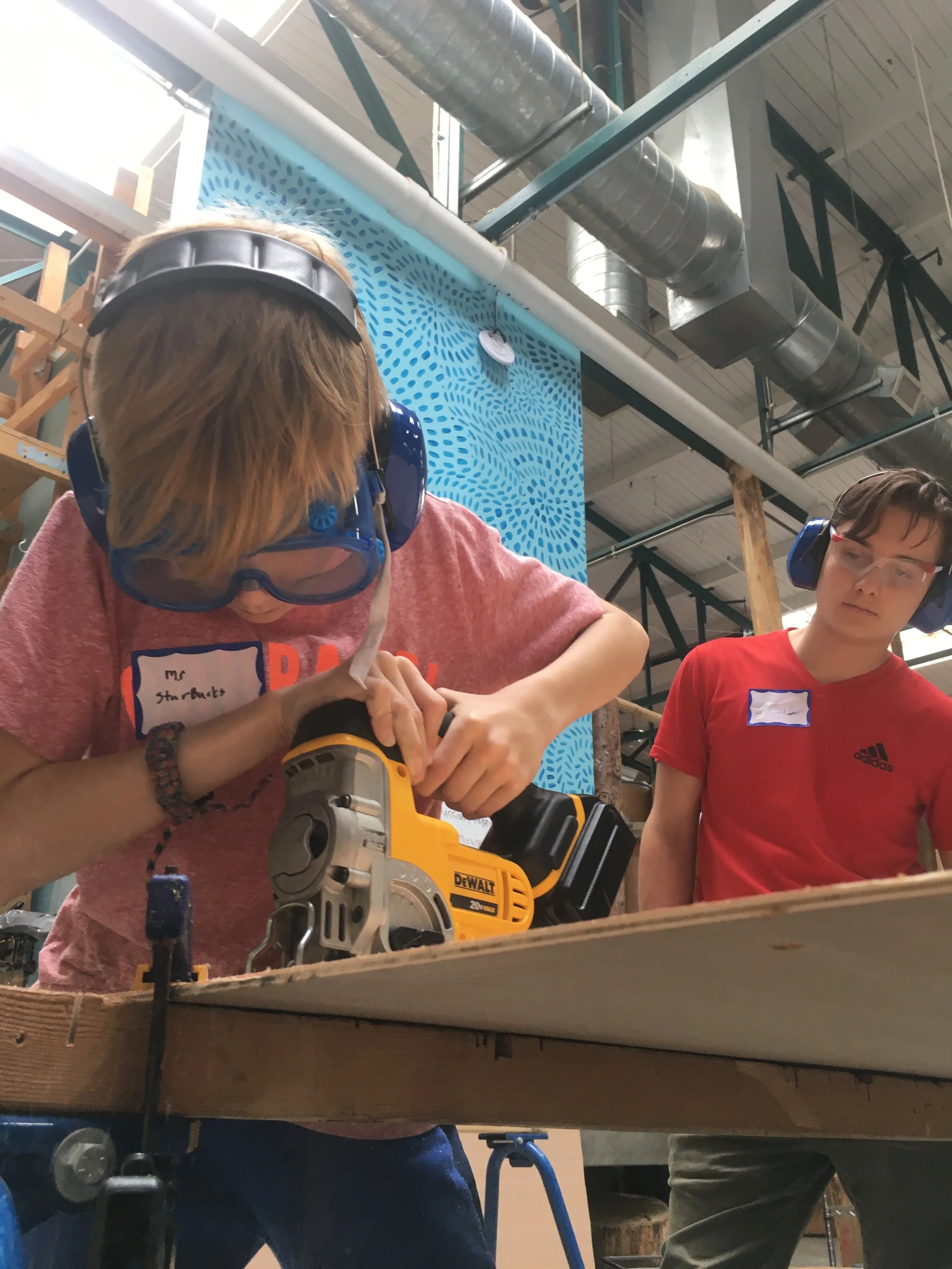 Clay cuts the sides to the train car.