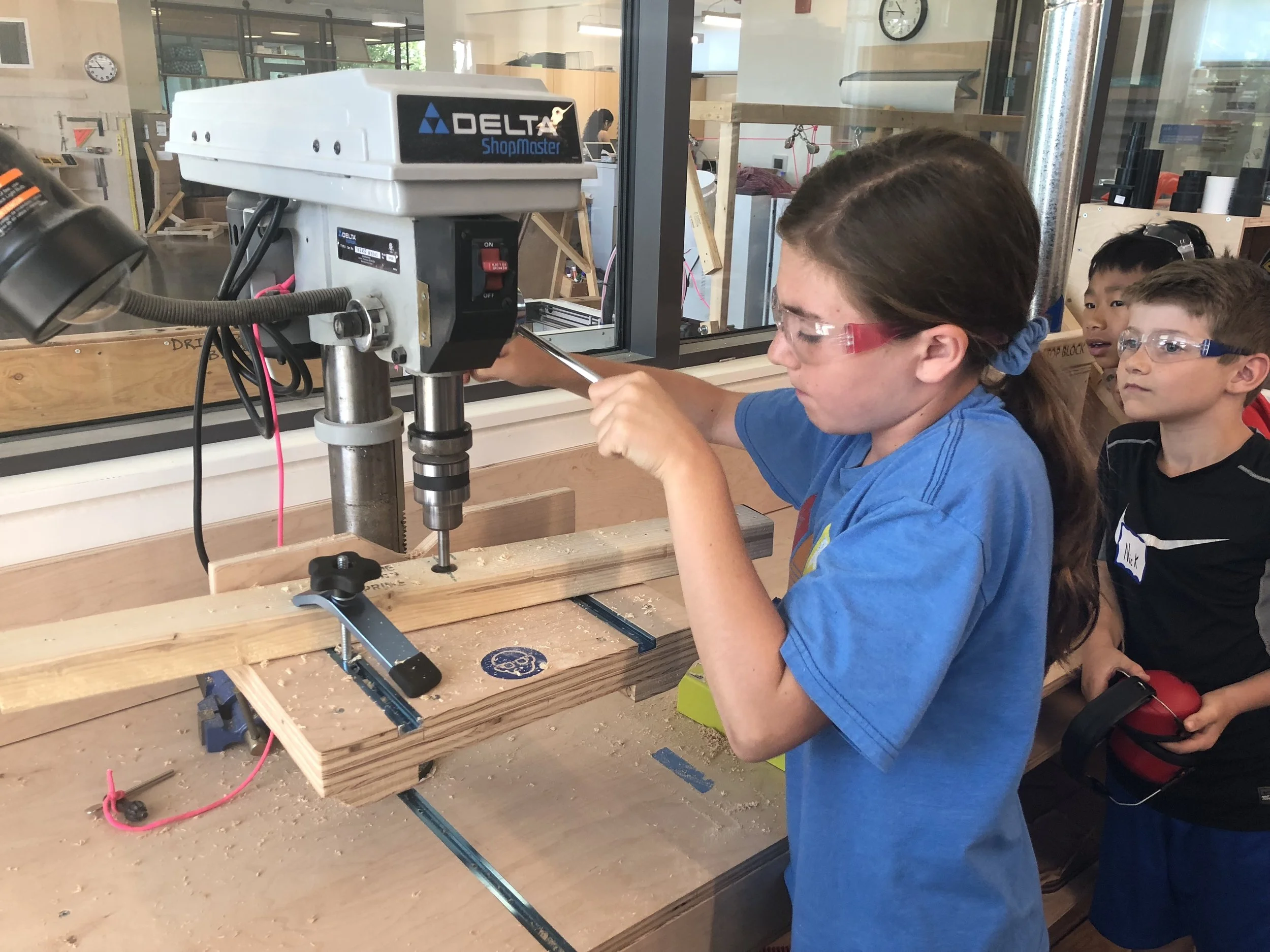 We use a drill press to make accurate, straight holes with large drill bits.