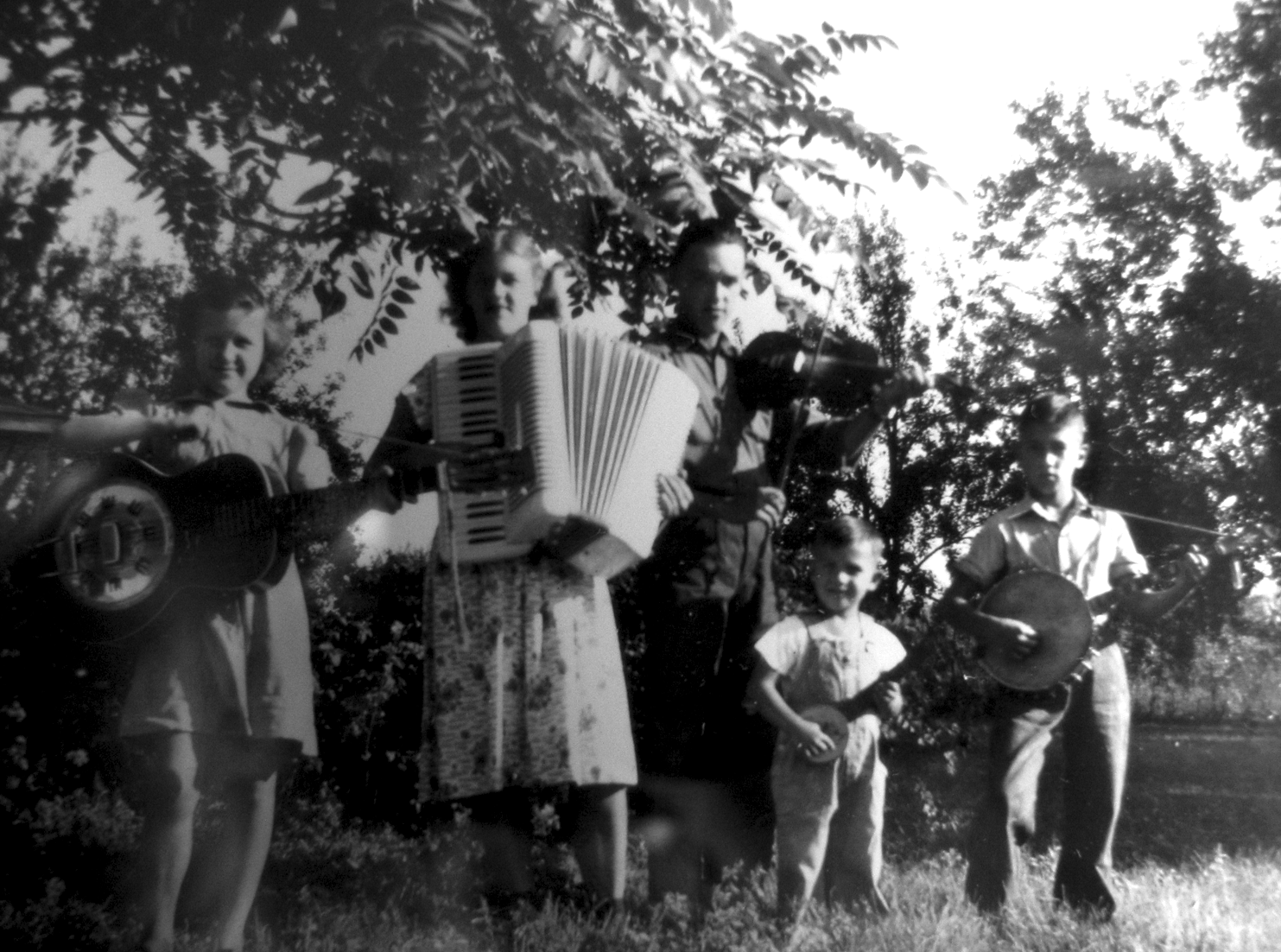 Bill (youngest) playing music with his siblings