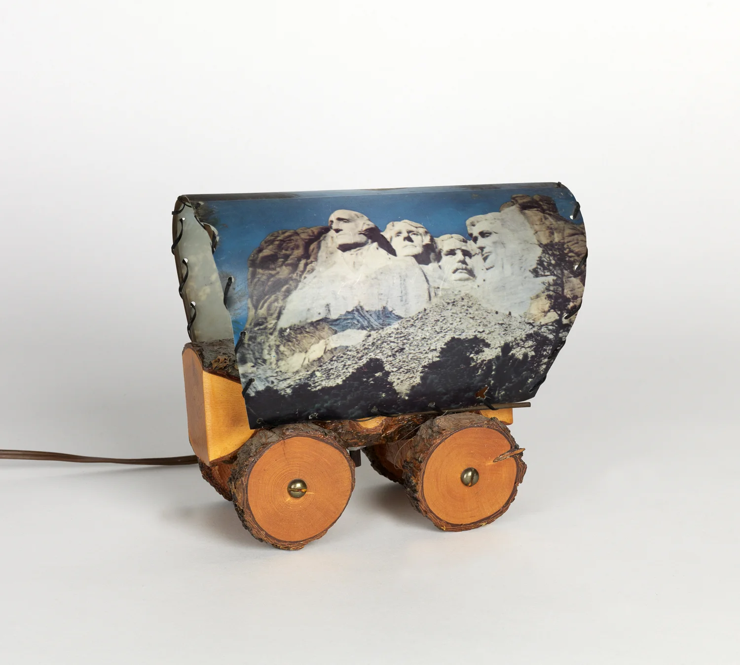 Television covered wagon lamp, with image of Mt. Rushmore. Circa 1958